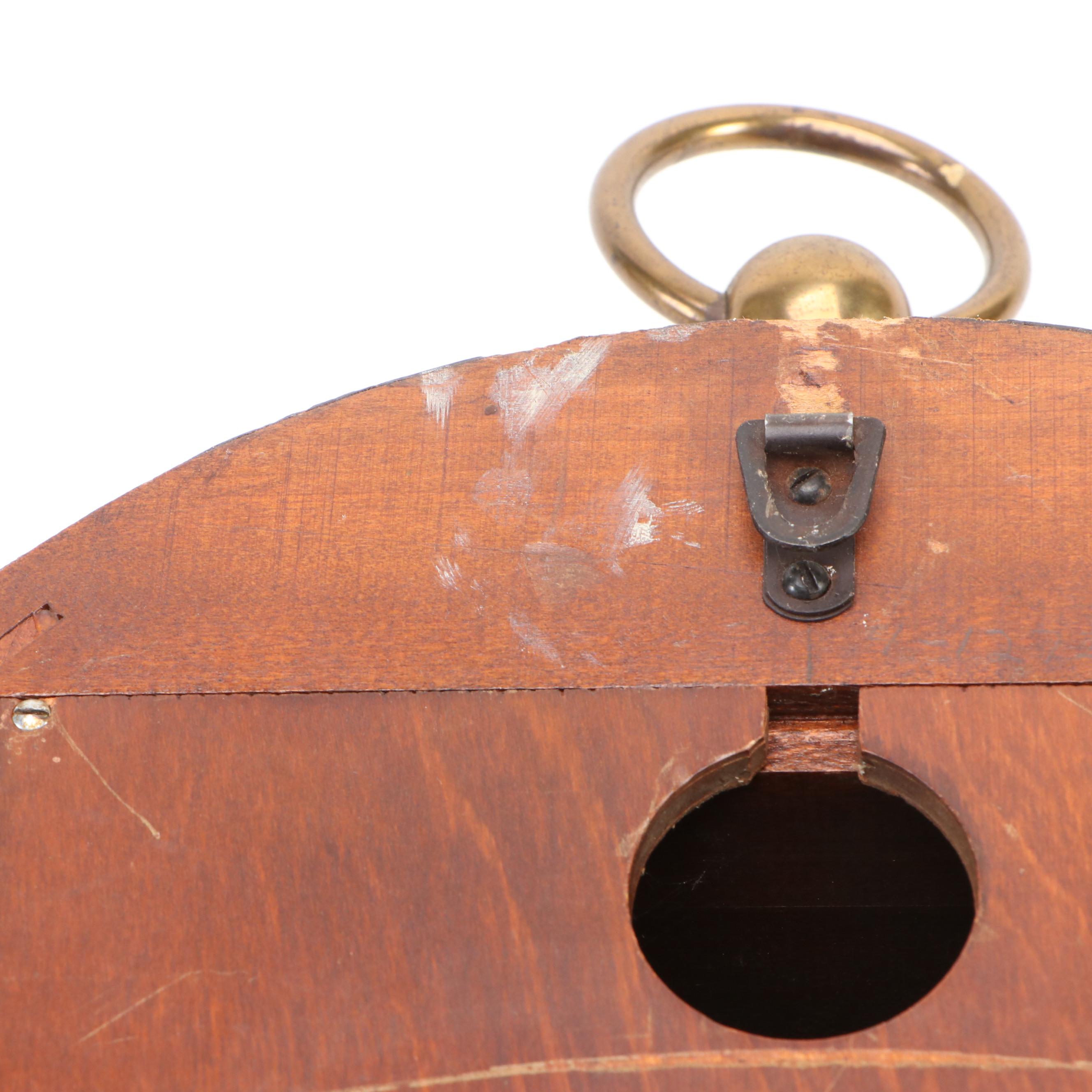 Howard Miller Laurel Motif Gilt Leather Wrapped Oval Wall Clock