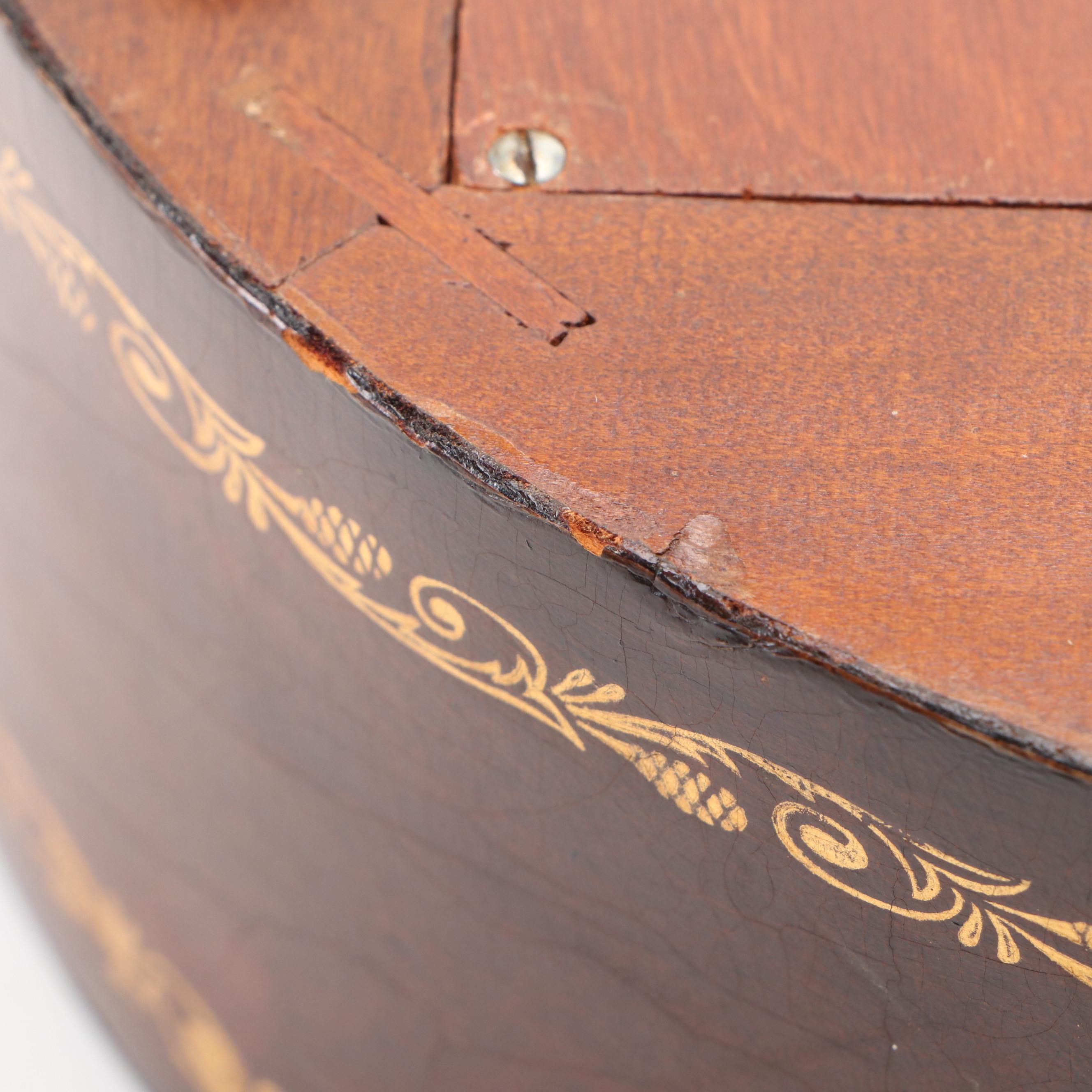 Howard Miller Laurel Motif Gilt Leather Wrapped Oval Wall Clock