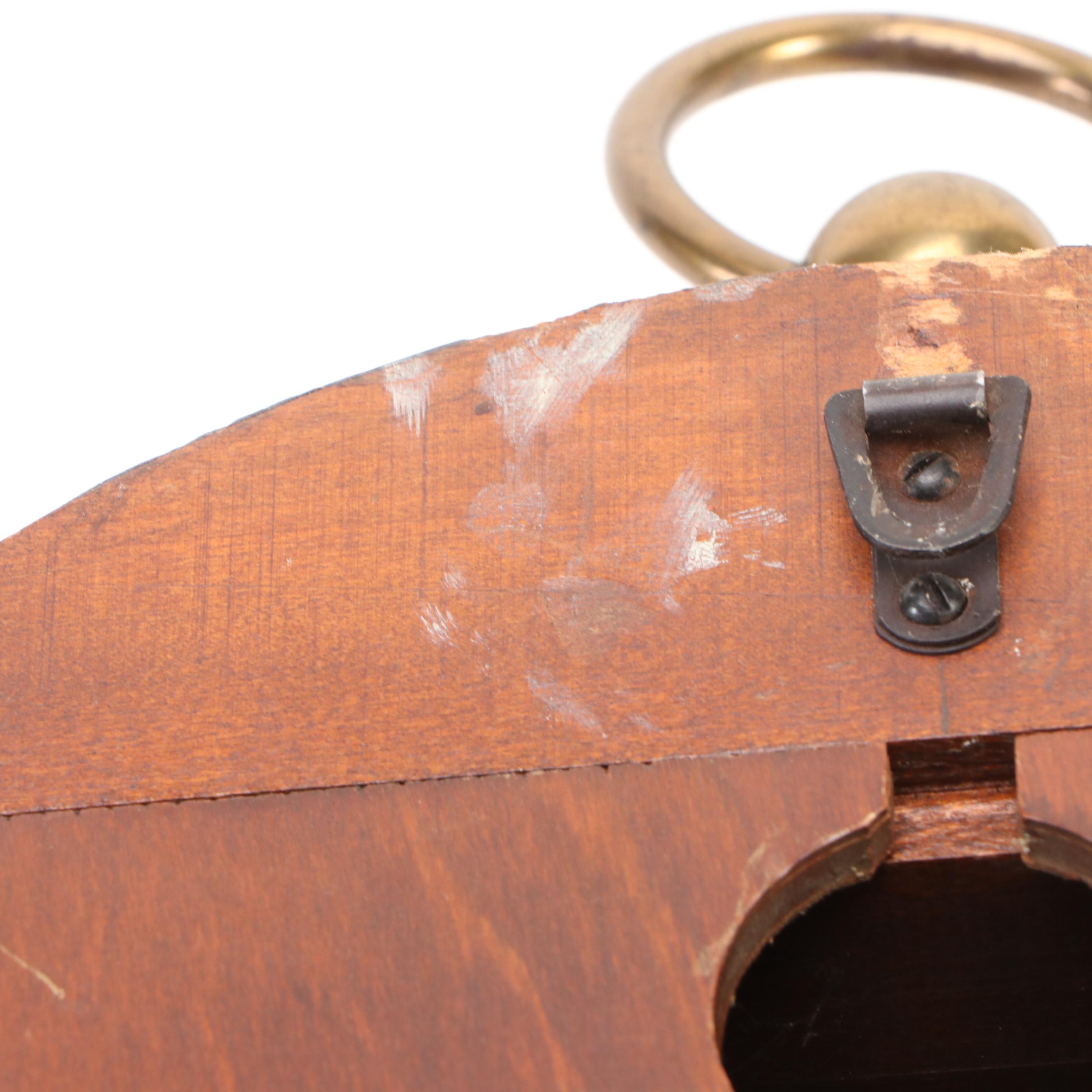 Howard Miller Laurel Motif Gilt Leather Wrapped Oval Wall Clock