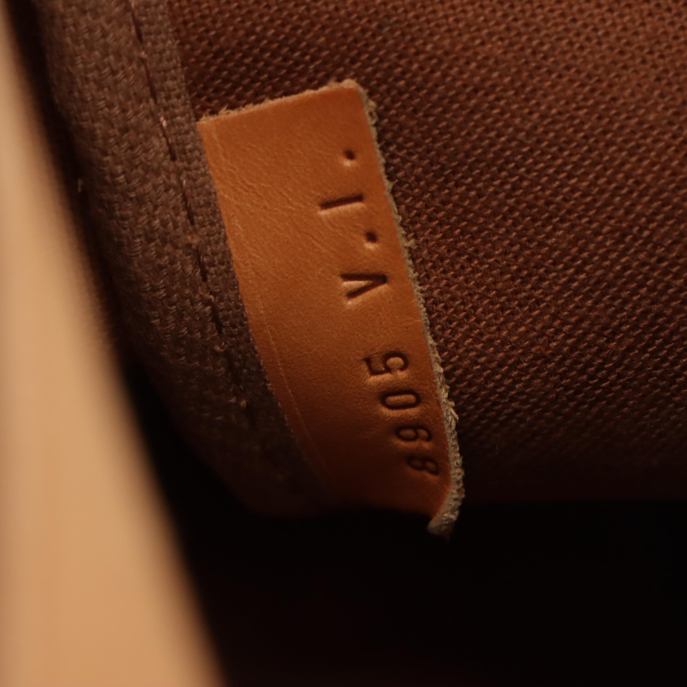 Louis Vuitton Saumur 35 in Monogram Canvas and Vachetta Leather