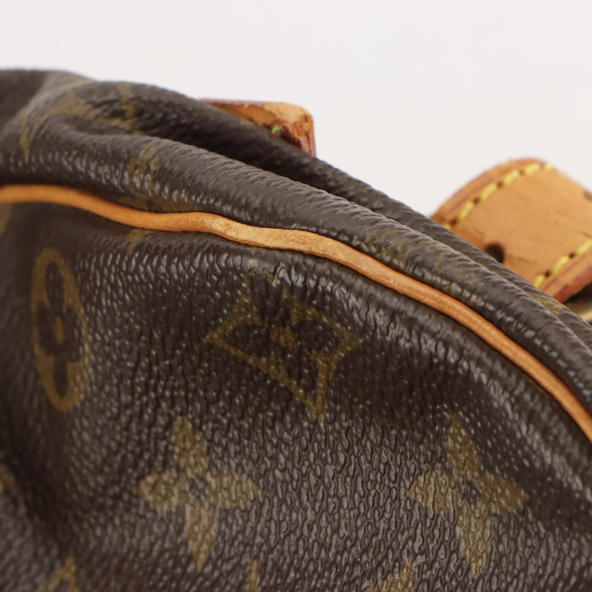 Louis Vuitton Saumur 35 in Monogram Canvas and Vachetta Leather