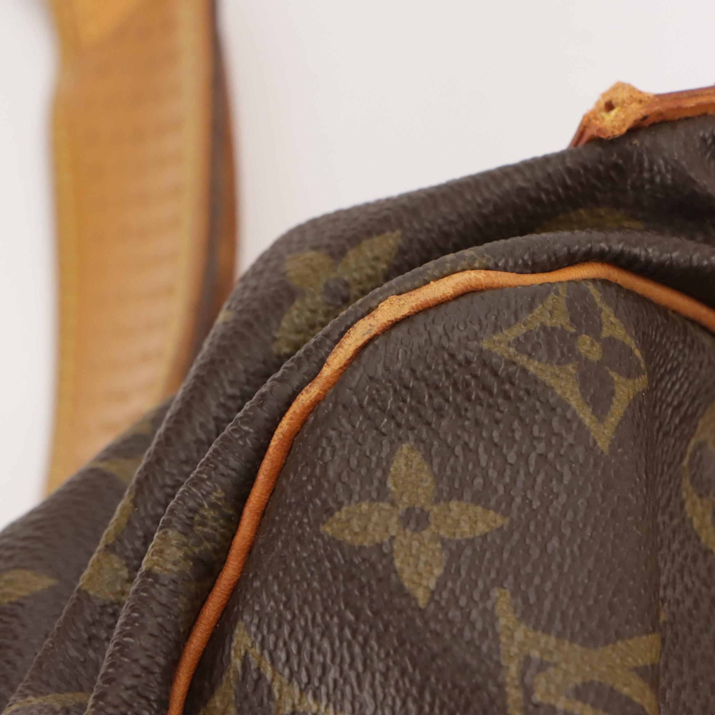 Louis Vuitton Saumur 35 in Monogram Canvas and Vachetta Leather