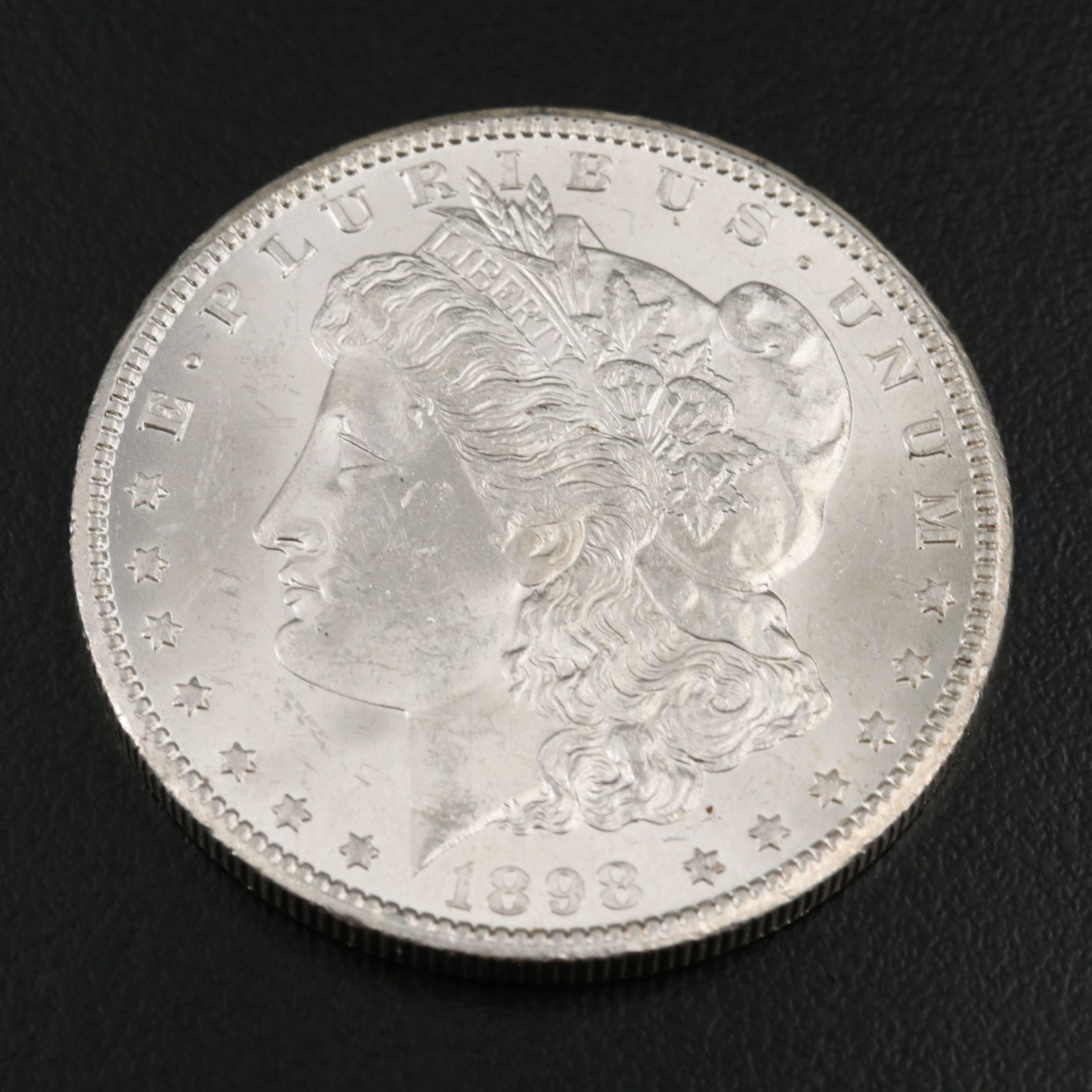 Two Morgan Silver Dollars an 1898-O and a 1904-O