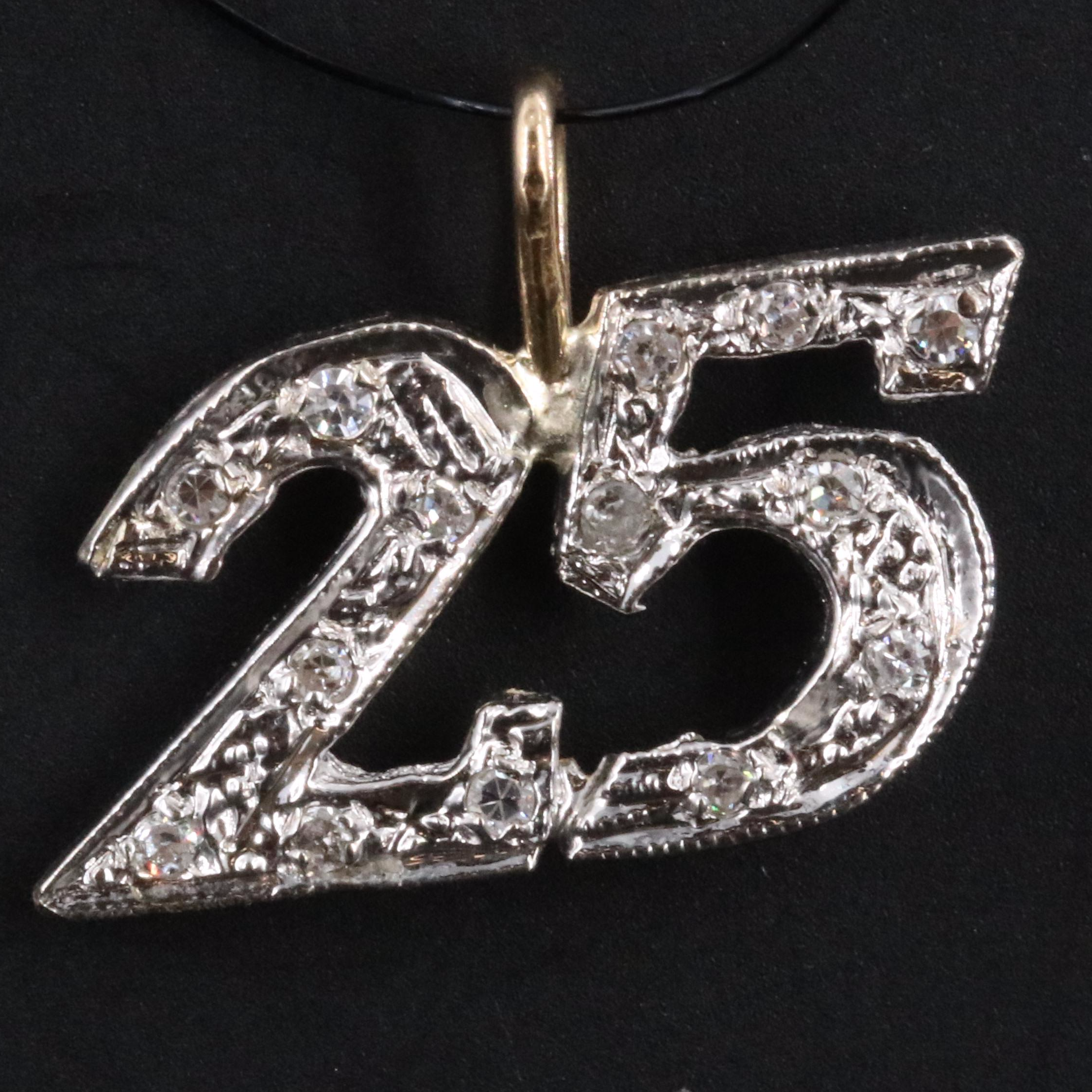 18K and 10K 0.10 CTW Diamond 25 Pendant