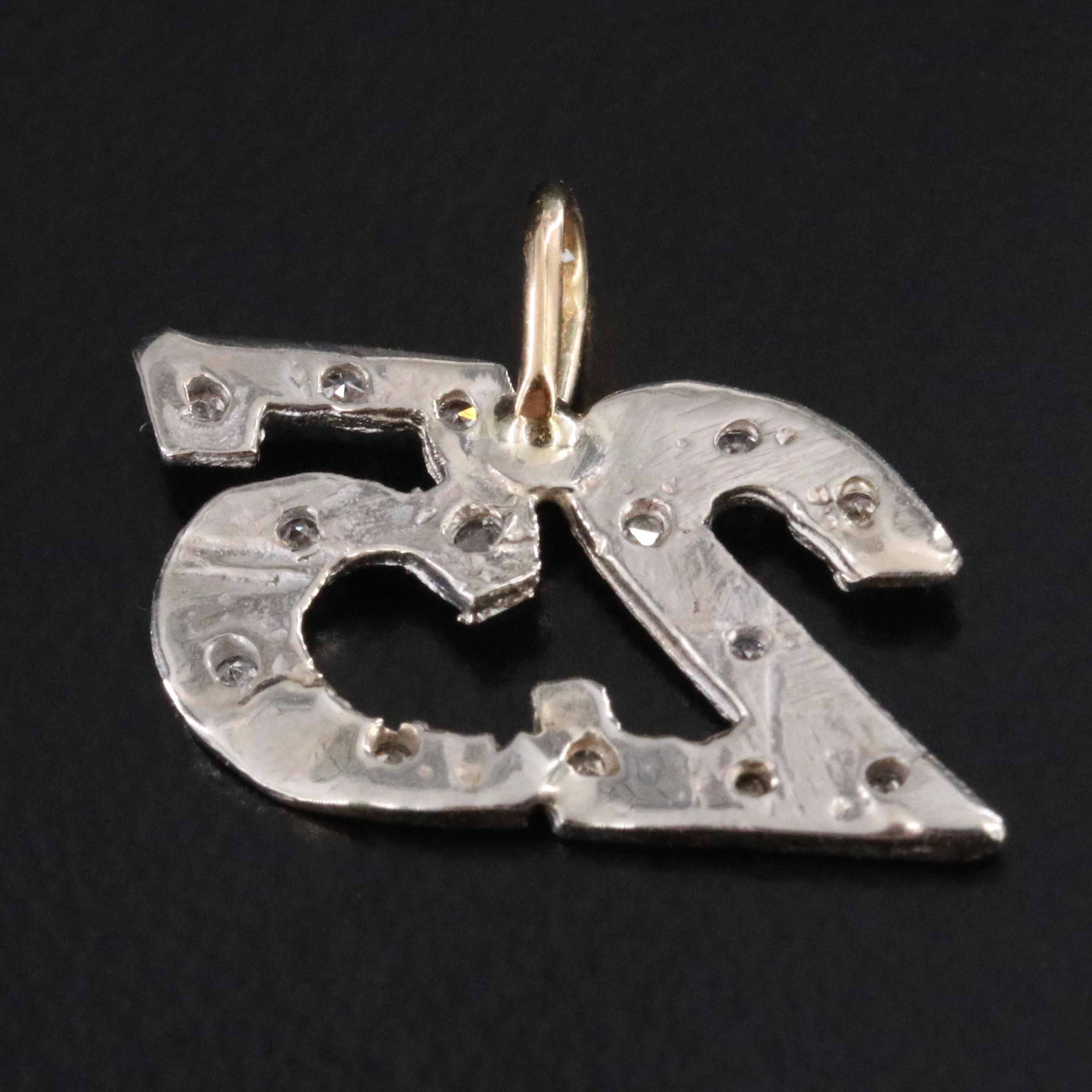 18K and 10K 0.10 CTW Diamond 25 Pendant