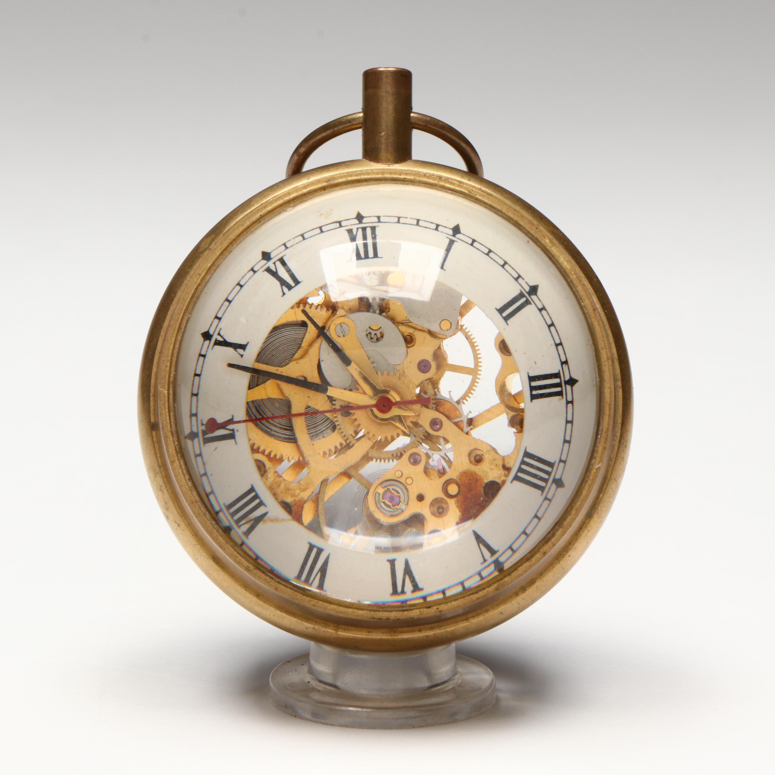 The Kings Brass and Glass Orb Shaped Skeleton Clock, 20th Century