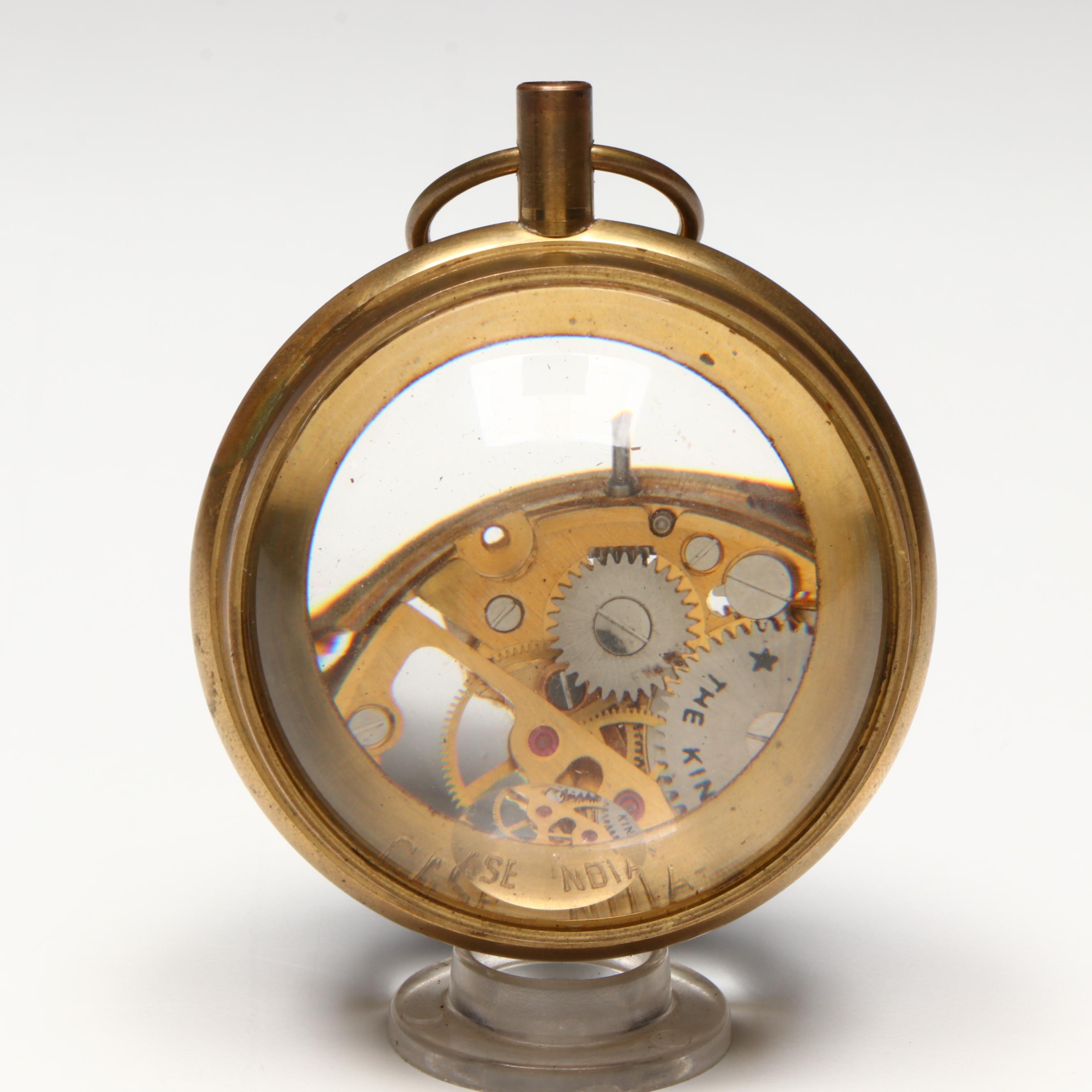 The Kings Brass and Glass Orb Shaped Skeleton Clock, 20th Century