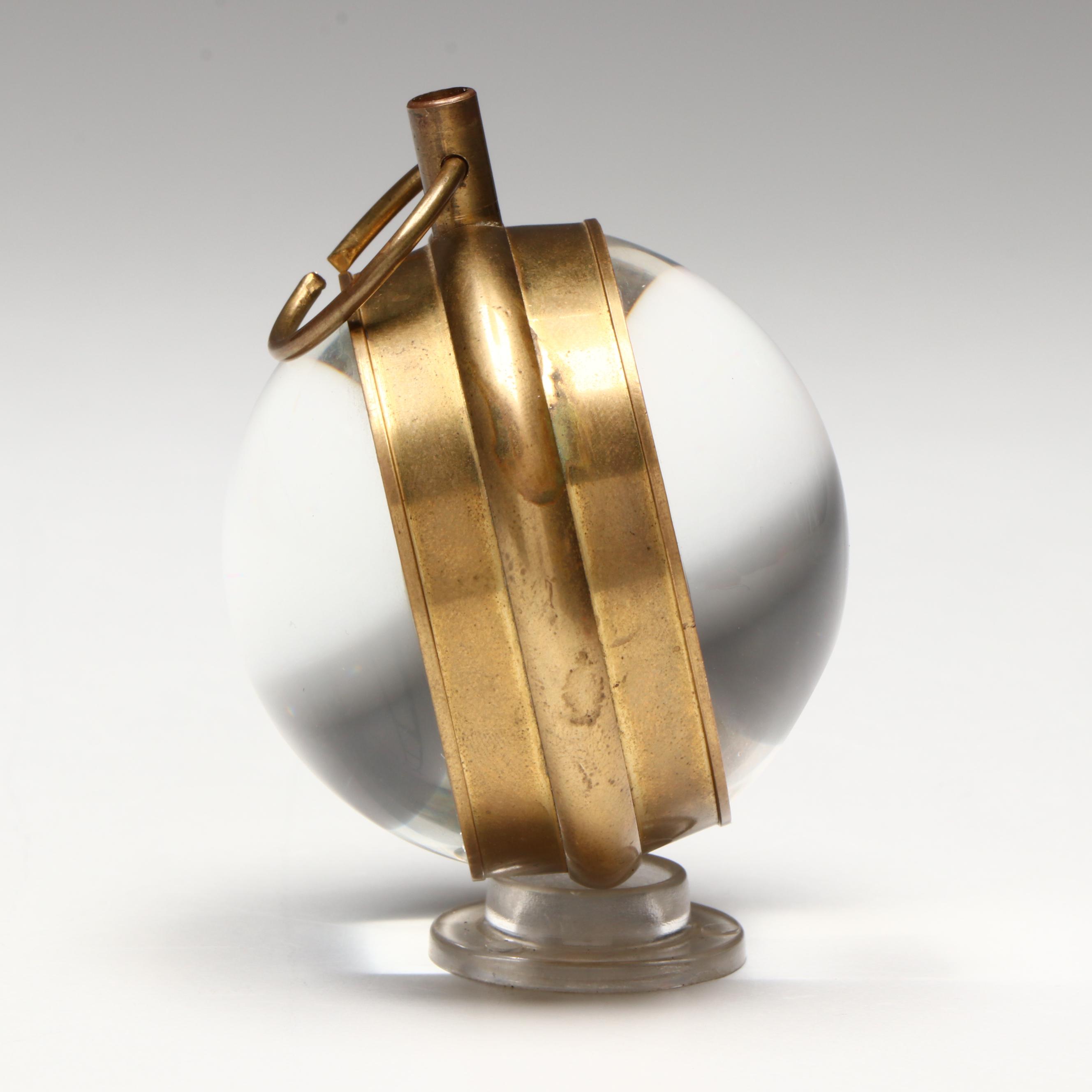 The Kings Brass and Glass Orb Shaped Skeleton Clock, 20th Century