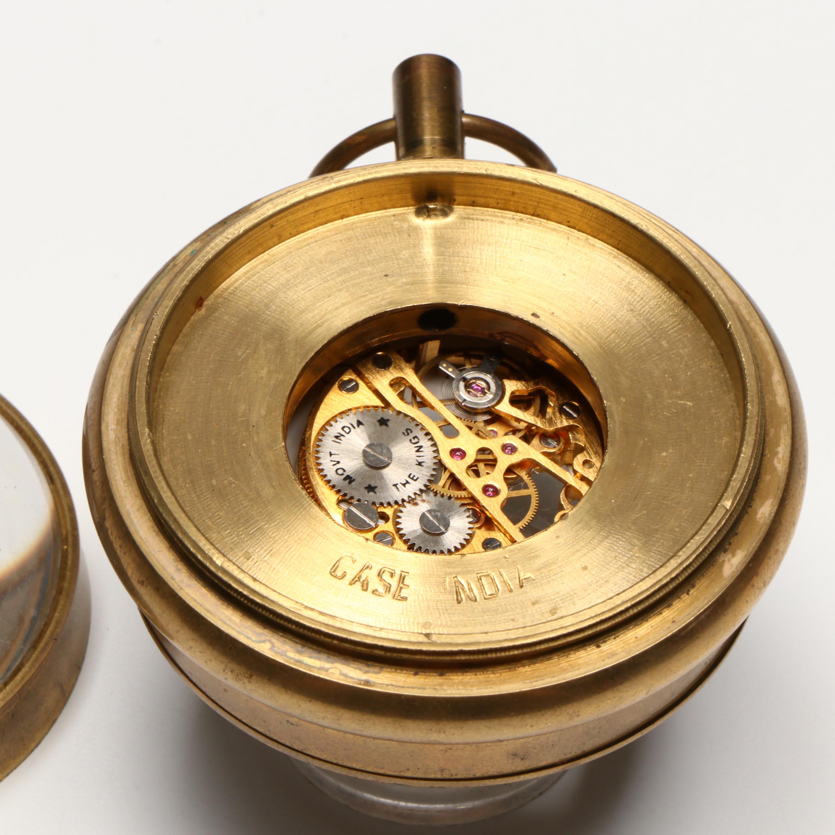 The Kings Brass and Glass Orb Shaped Skeleton Clock, 20th Century