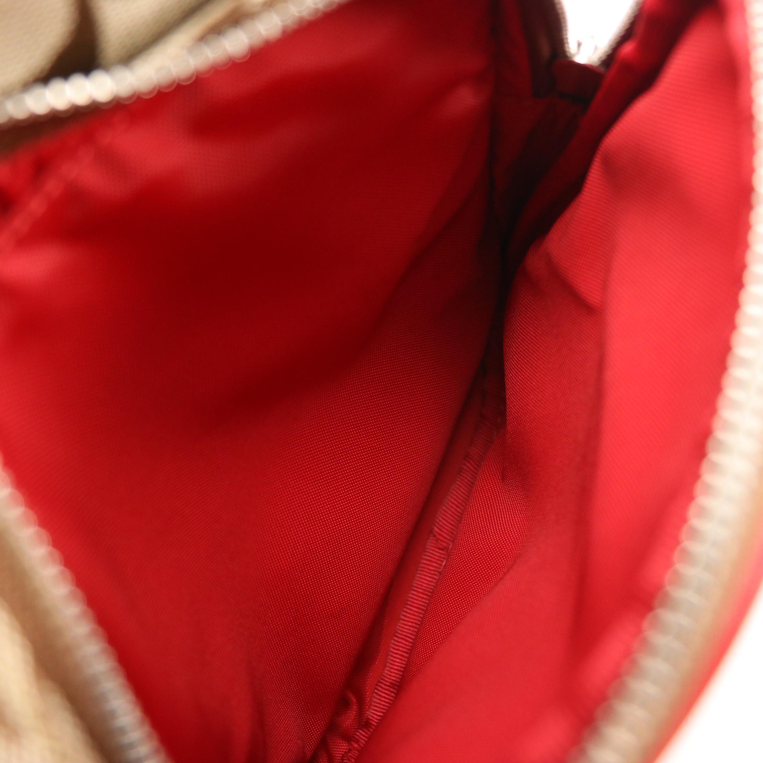 Coach Signature Canvas Sling Bag with Red Leather Trim