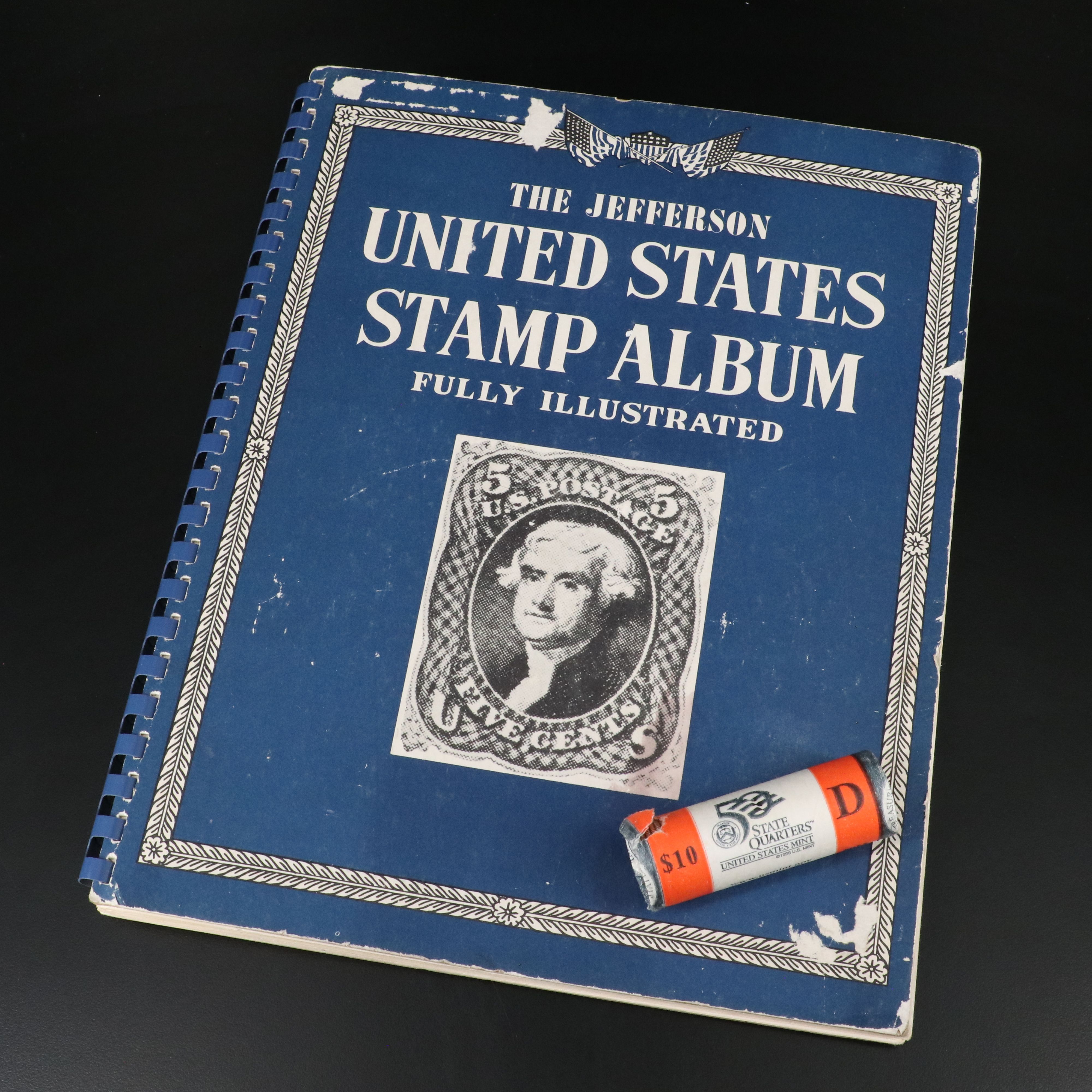 Jefferson United States stamp album and a Mint Roll of State Quarters