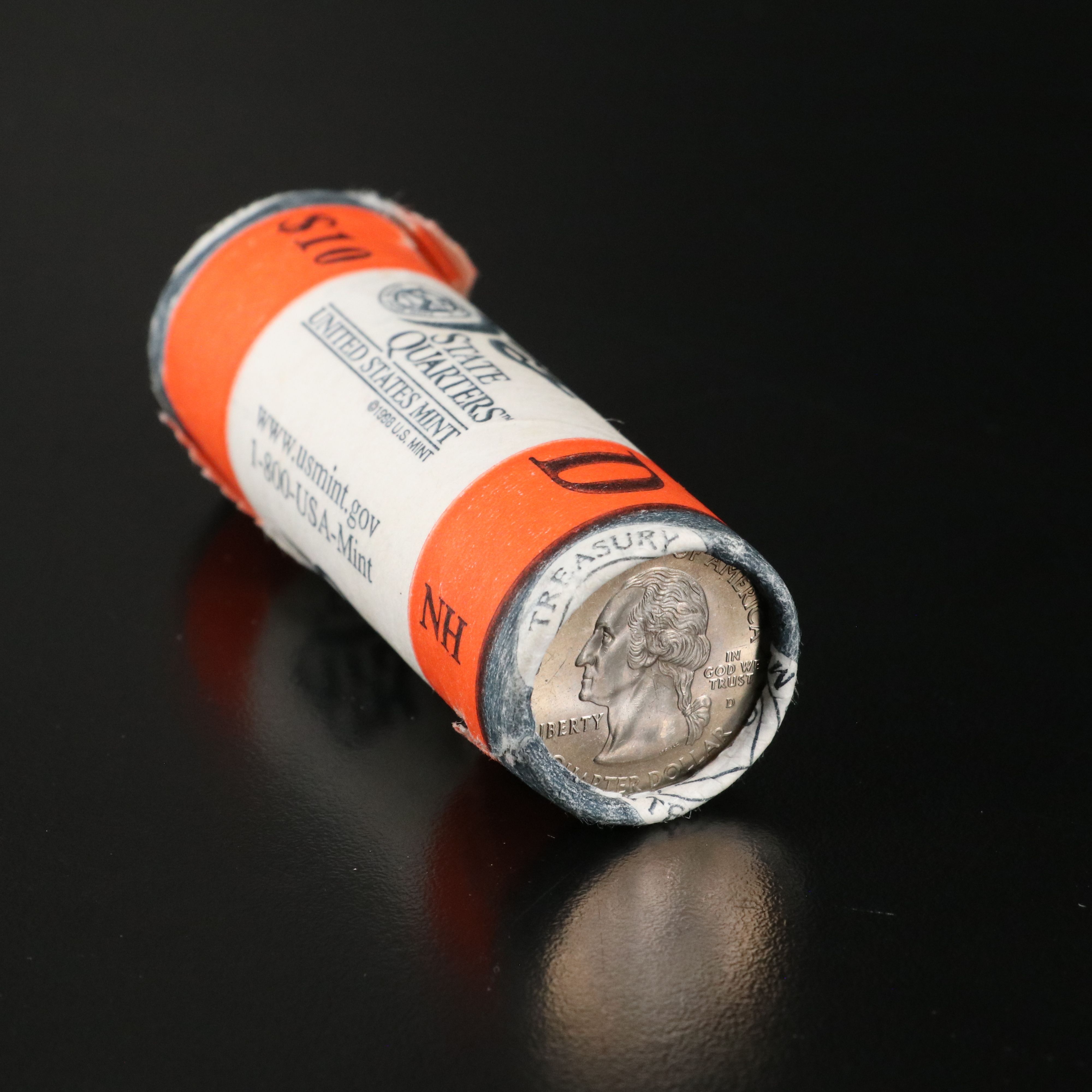 Jefferson United States stamp album and a Mint Roll of State Quarters