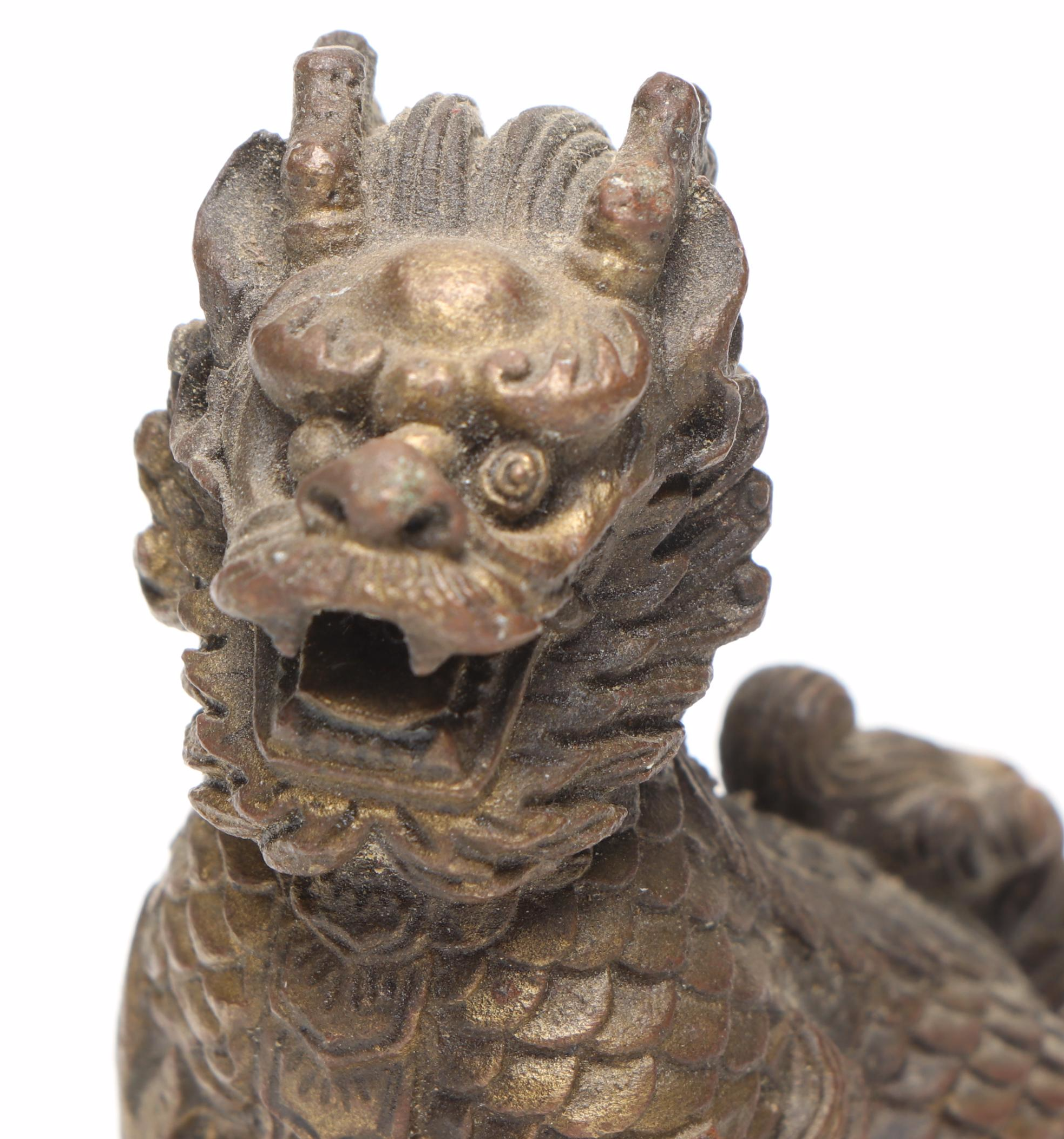 Brass Qilin on Coins, with Verdigris Qilin and Black Resin Guardian Lion