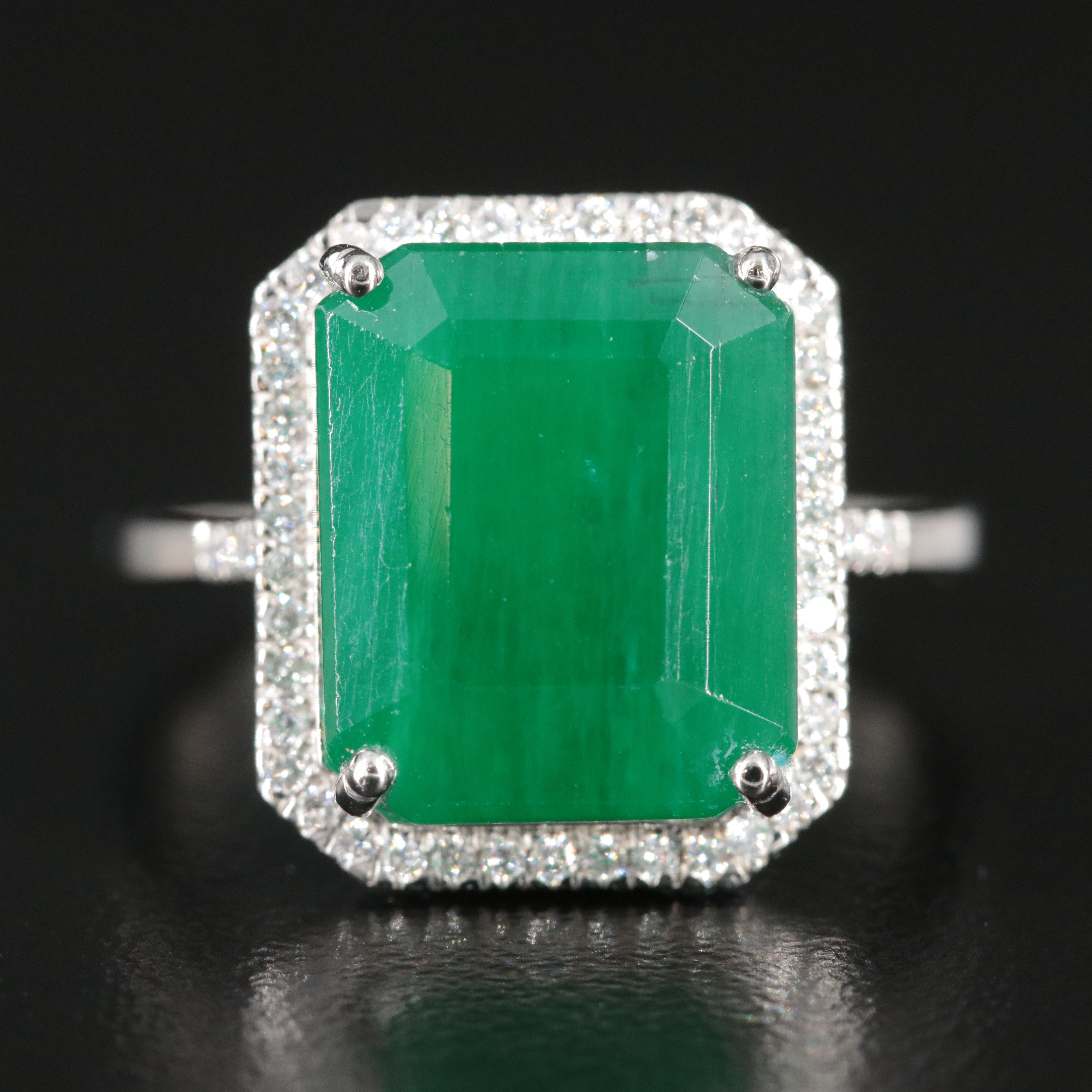 Platinum 7.33 CT Emerald and 0.18 CTW Diamond Ring