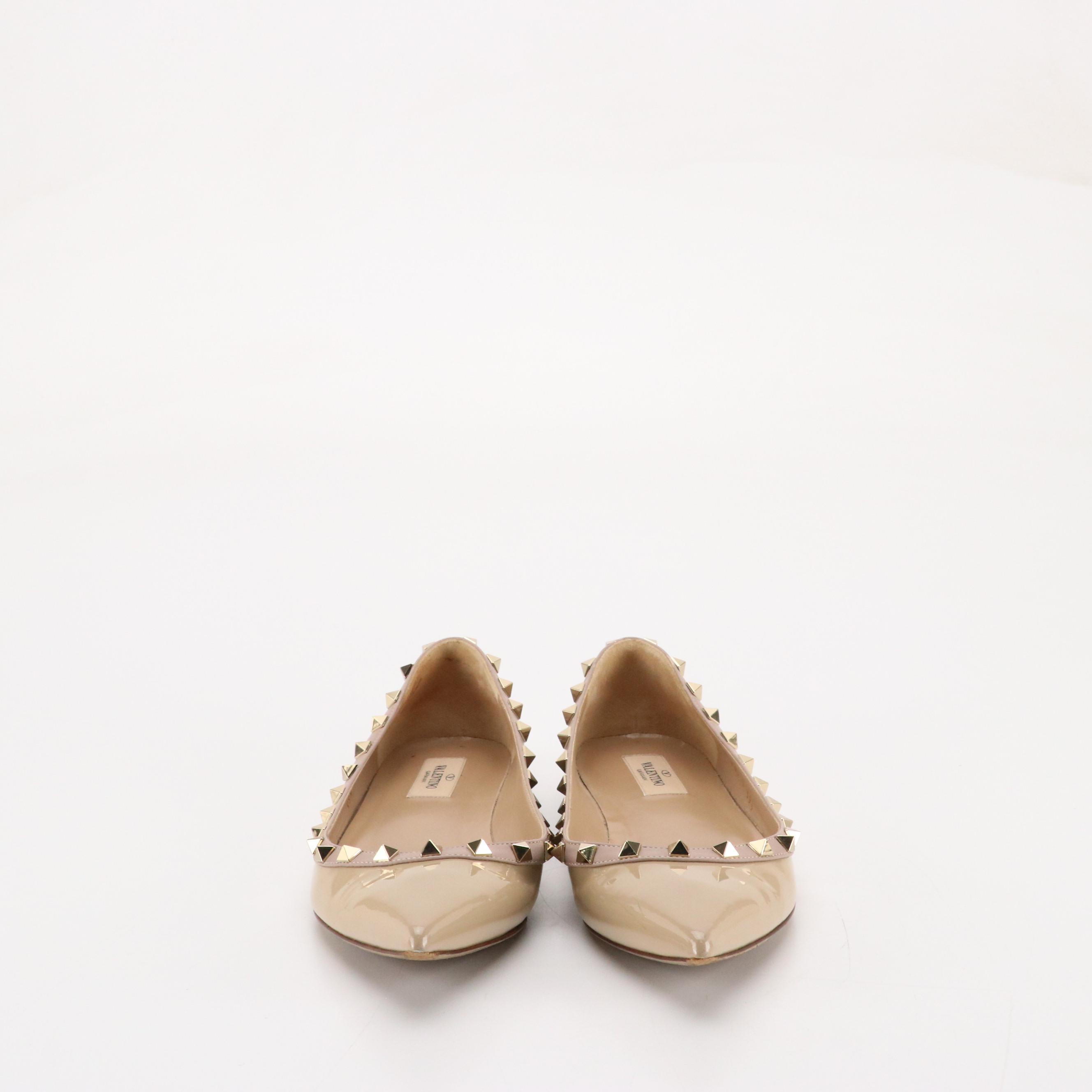 Valentino Garavani Pointed-Toe Rockstud Flats in Beige Patent Leather