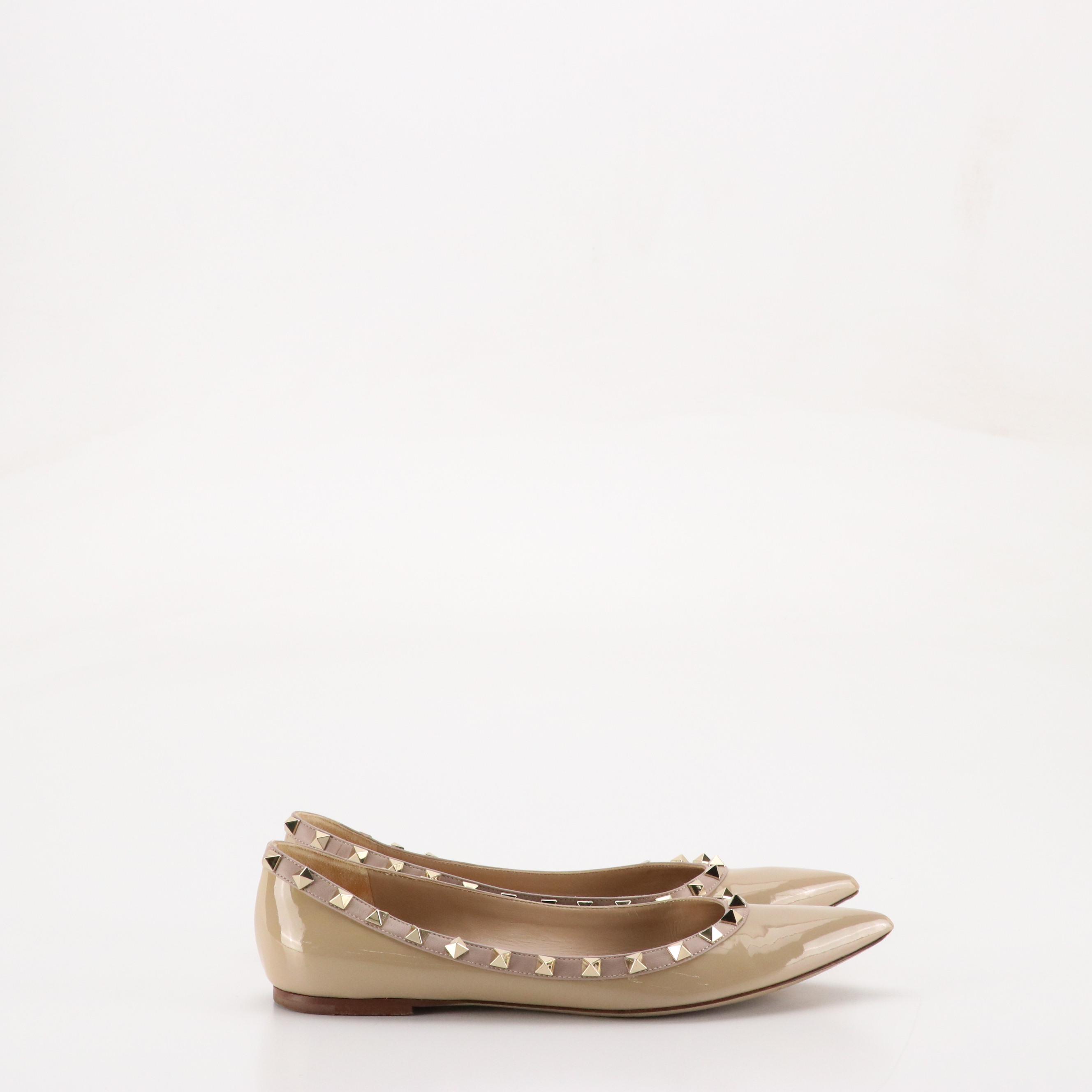Valentino Garavani Pointed-Toe Rockstud Flats in Beige Patent Leather