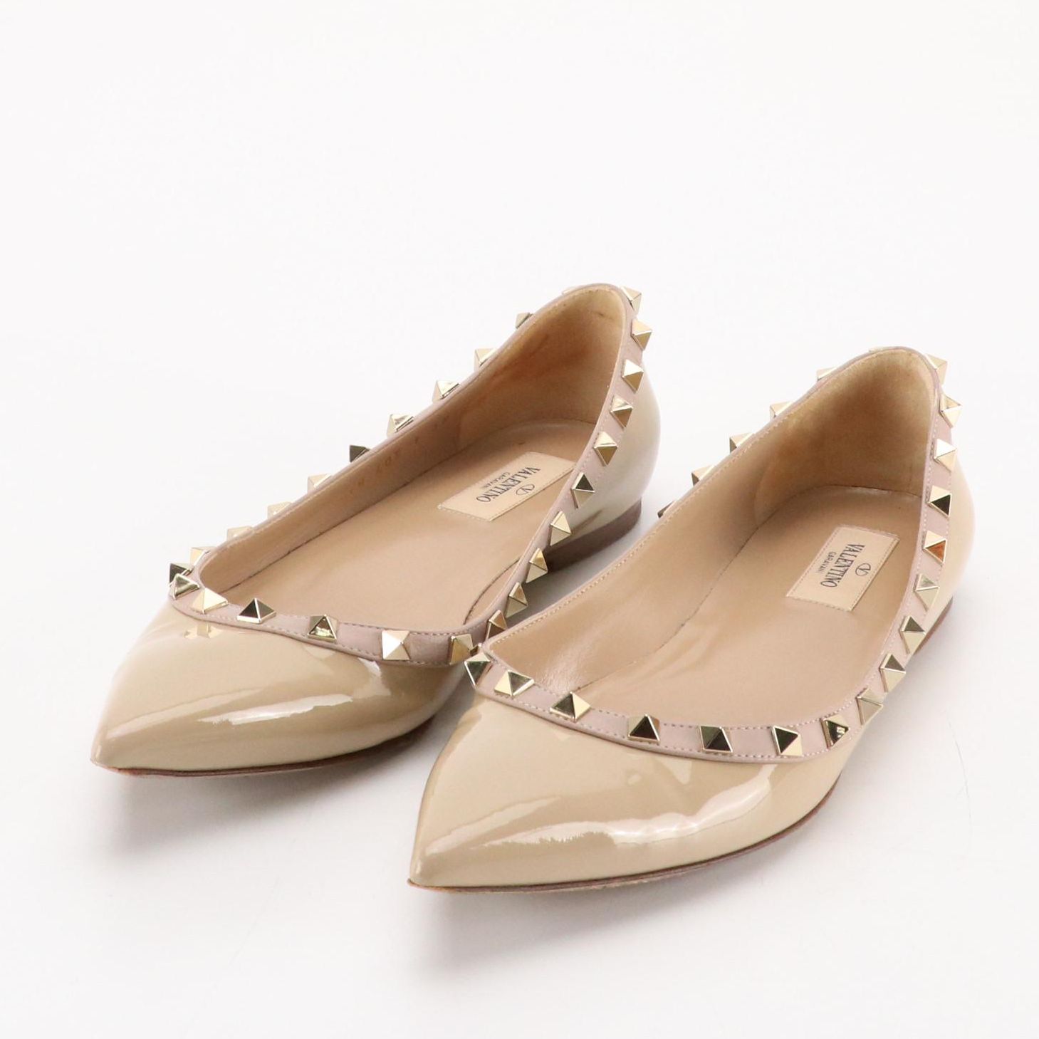 Valentino Garavani Pointed-Toe Rockstud Flats in Beige Patent Leather