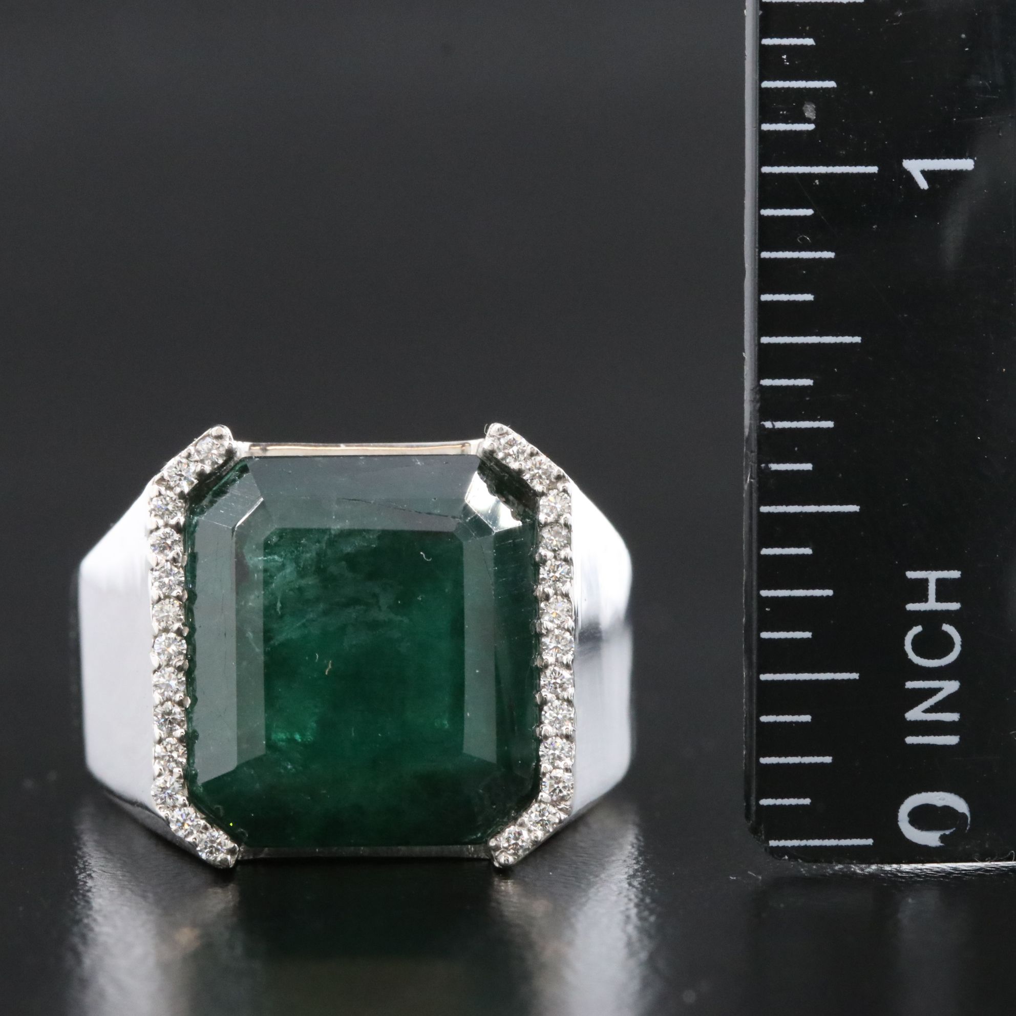 Platinum 15.50 CT Emerald and 0.17 CTW Diamond Ring