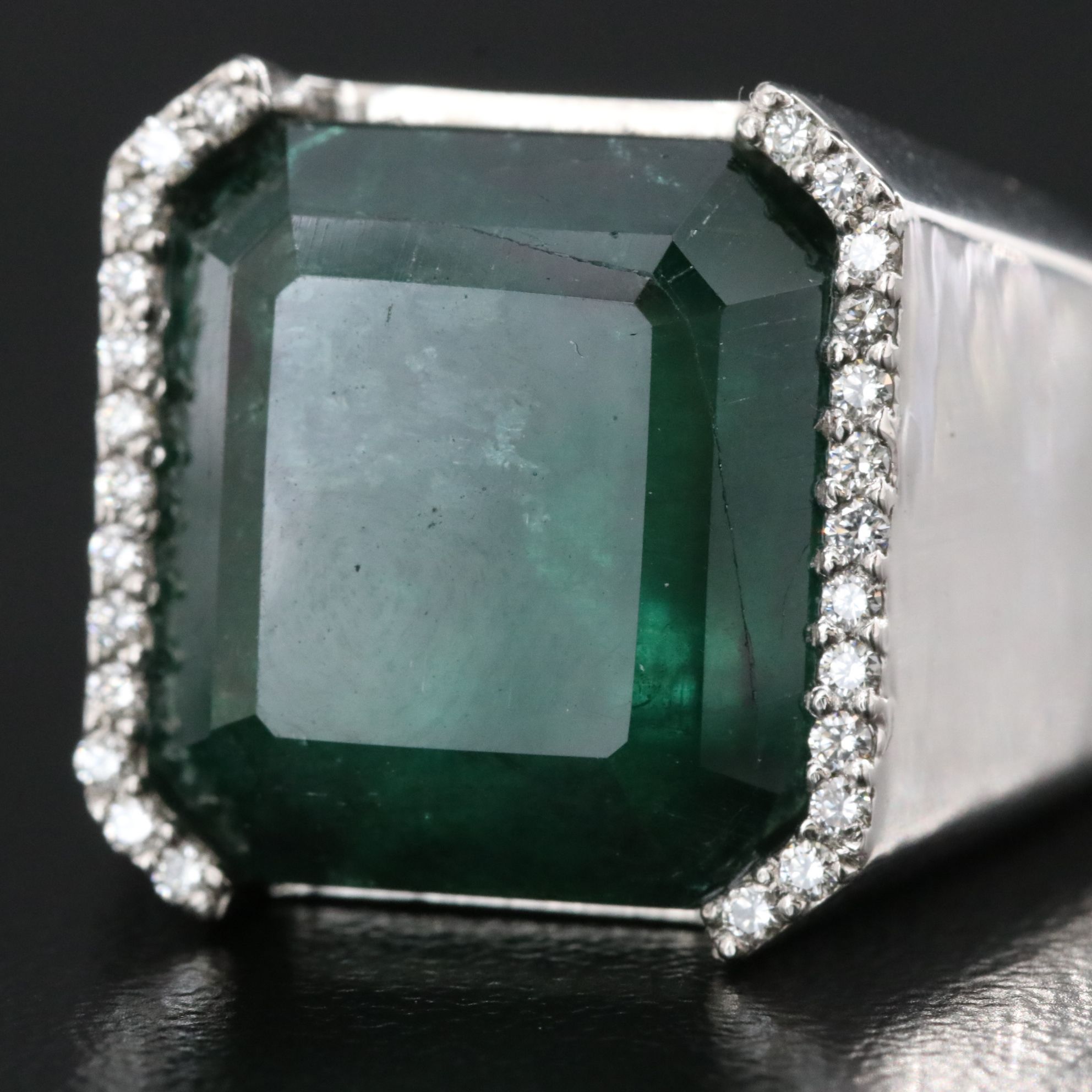 Platinum 15.50 CT Emerald and 0.17 CTW Diamond Ring