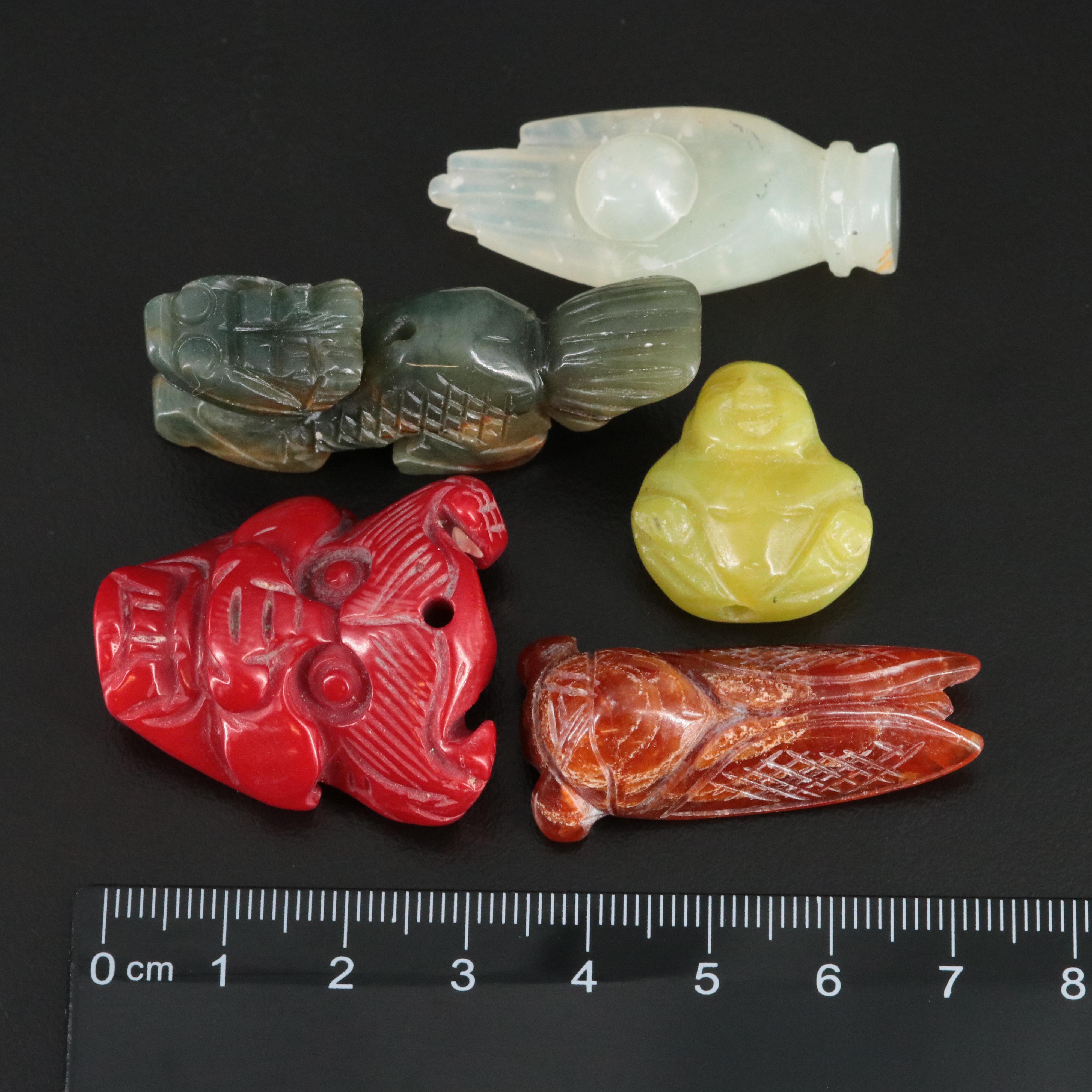 Carved Gemstone Pendants and Figurines Featuring Coral, Chalcedony and Calcite
