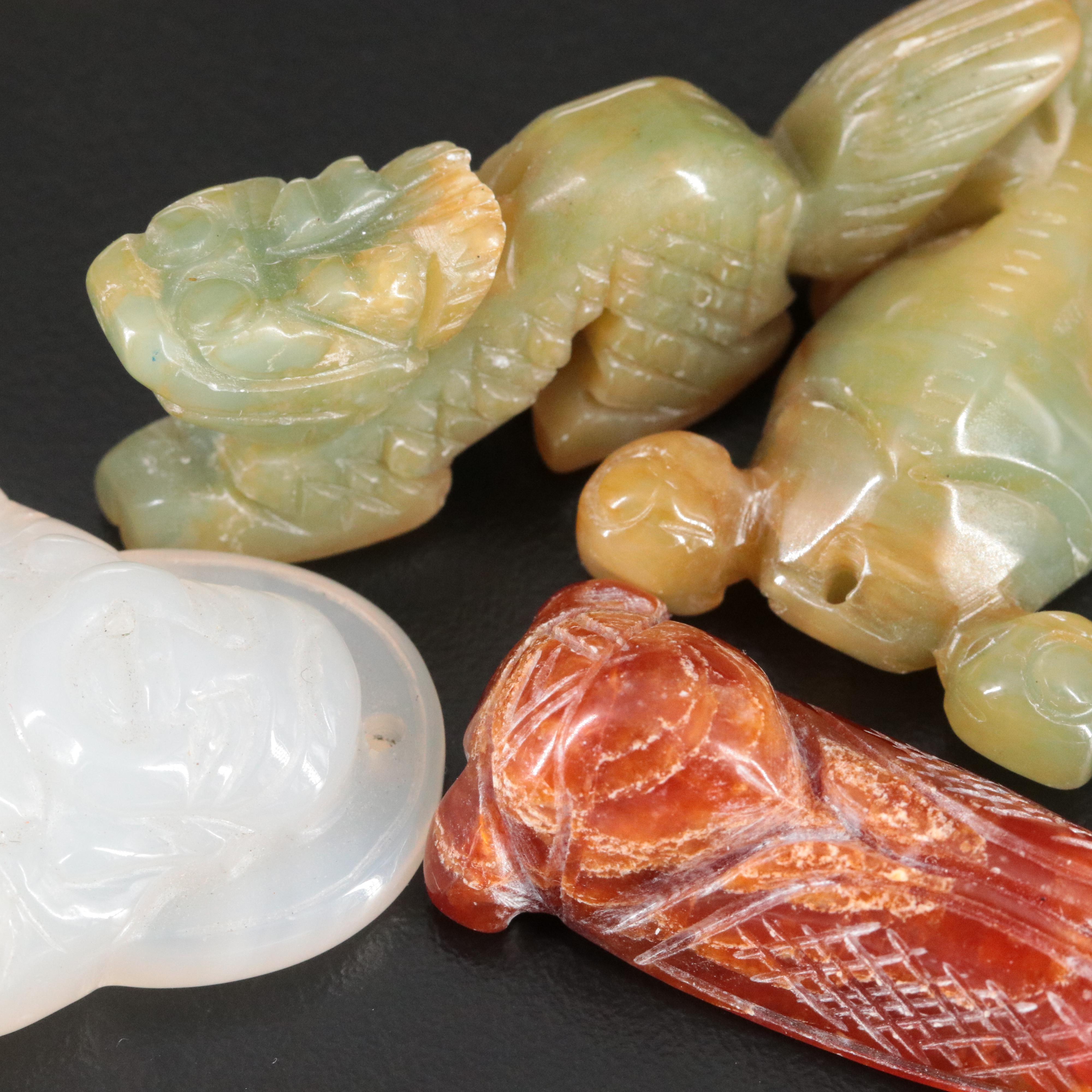 Carved Gemstone Pendants and Figurines Featuring Coral, Chalcedony and Calcite