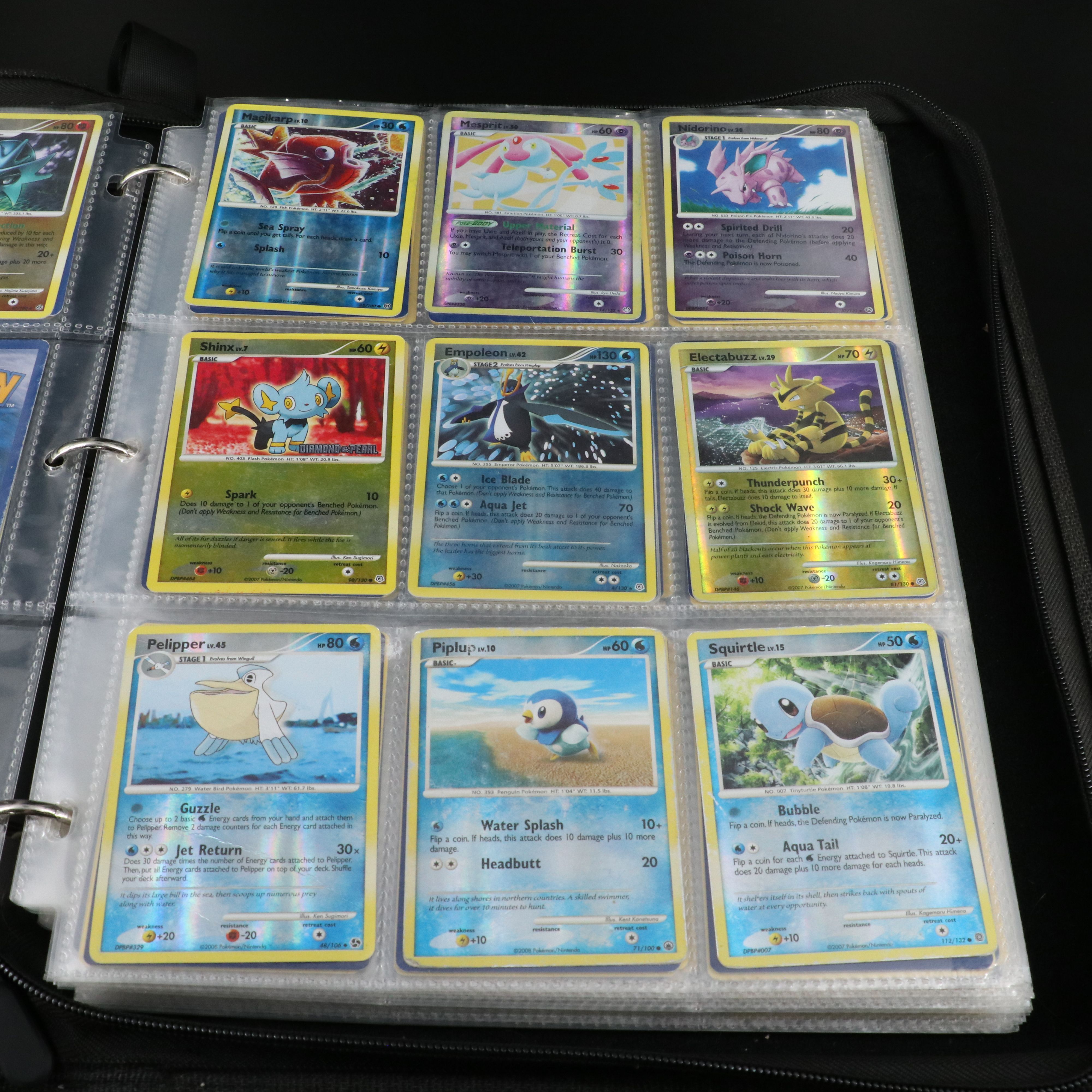 Over 660 Pokemon Trading Cards in Two Binders