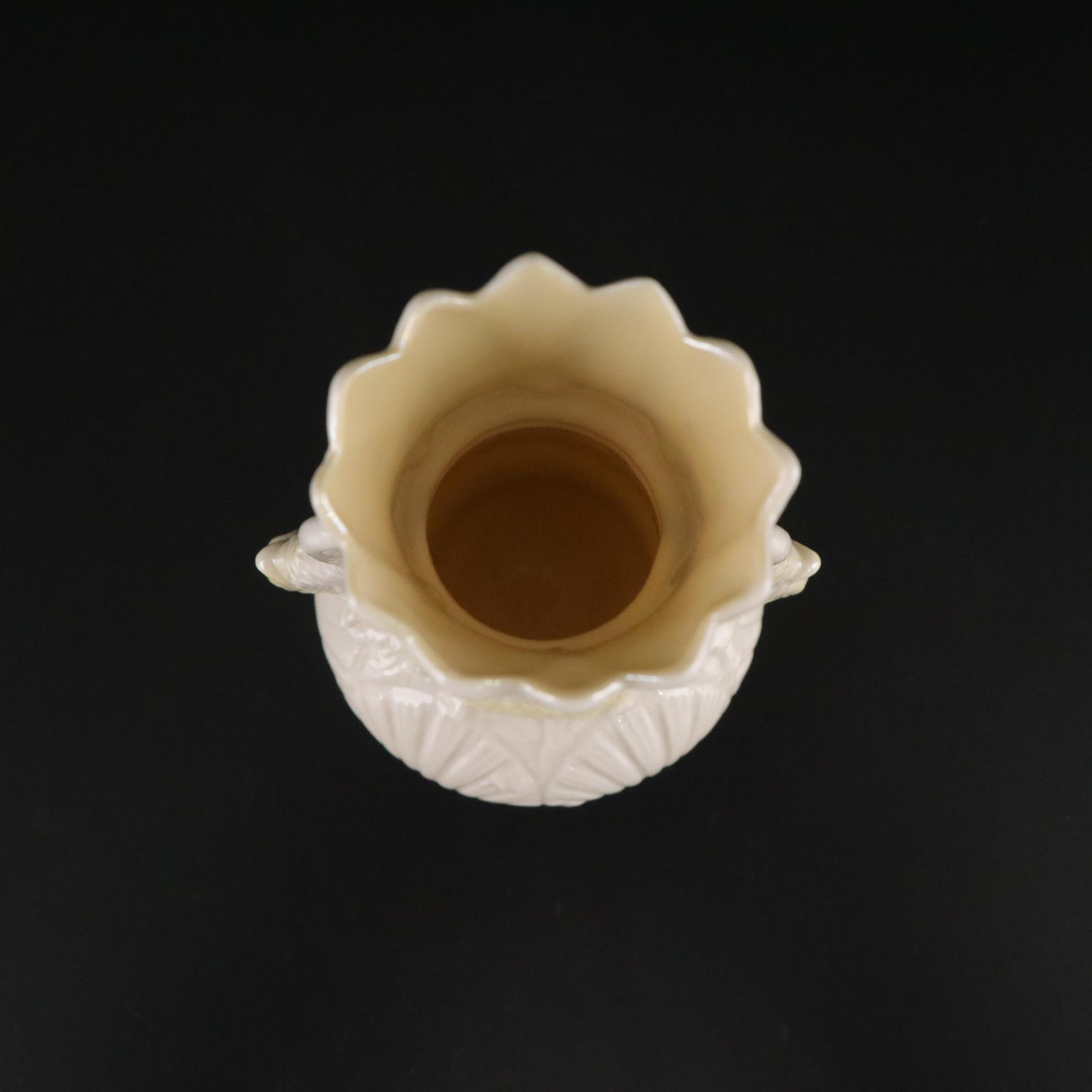 Belleek Porcelain "Dolphin" Spill Vase, Boat Shaped Ashtray, and Two Nut Cups