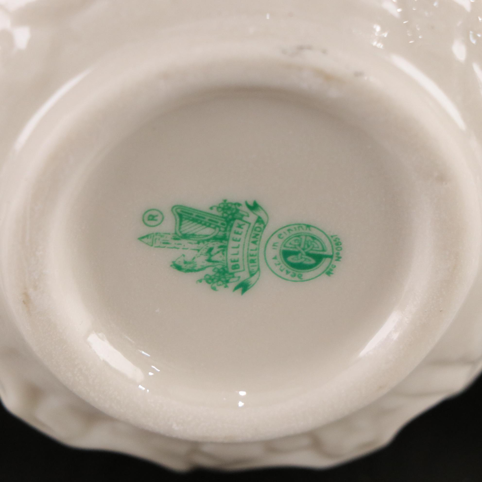 Belleek Porcelain "Dolphin" Spill Vase, Boat Shaped Ashtray, and Two Nut Cups