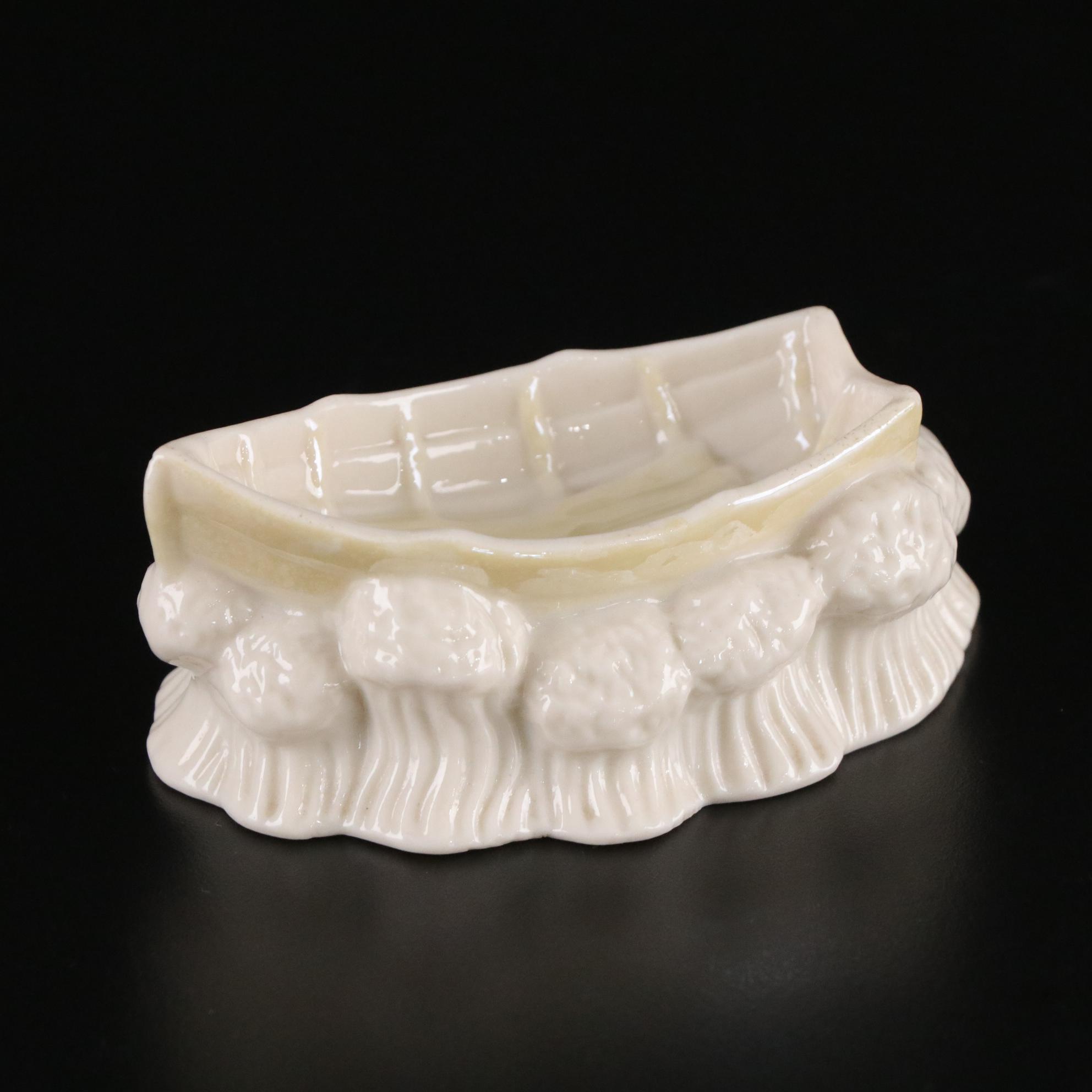 Belleek Porcelain "Dolphin" Spill Vase, Boat Shaped Ashtray, and Two Nut Cups