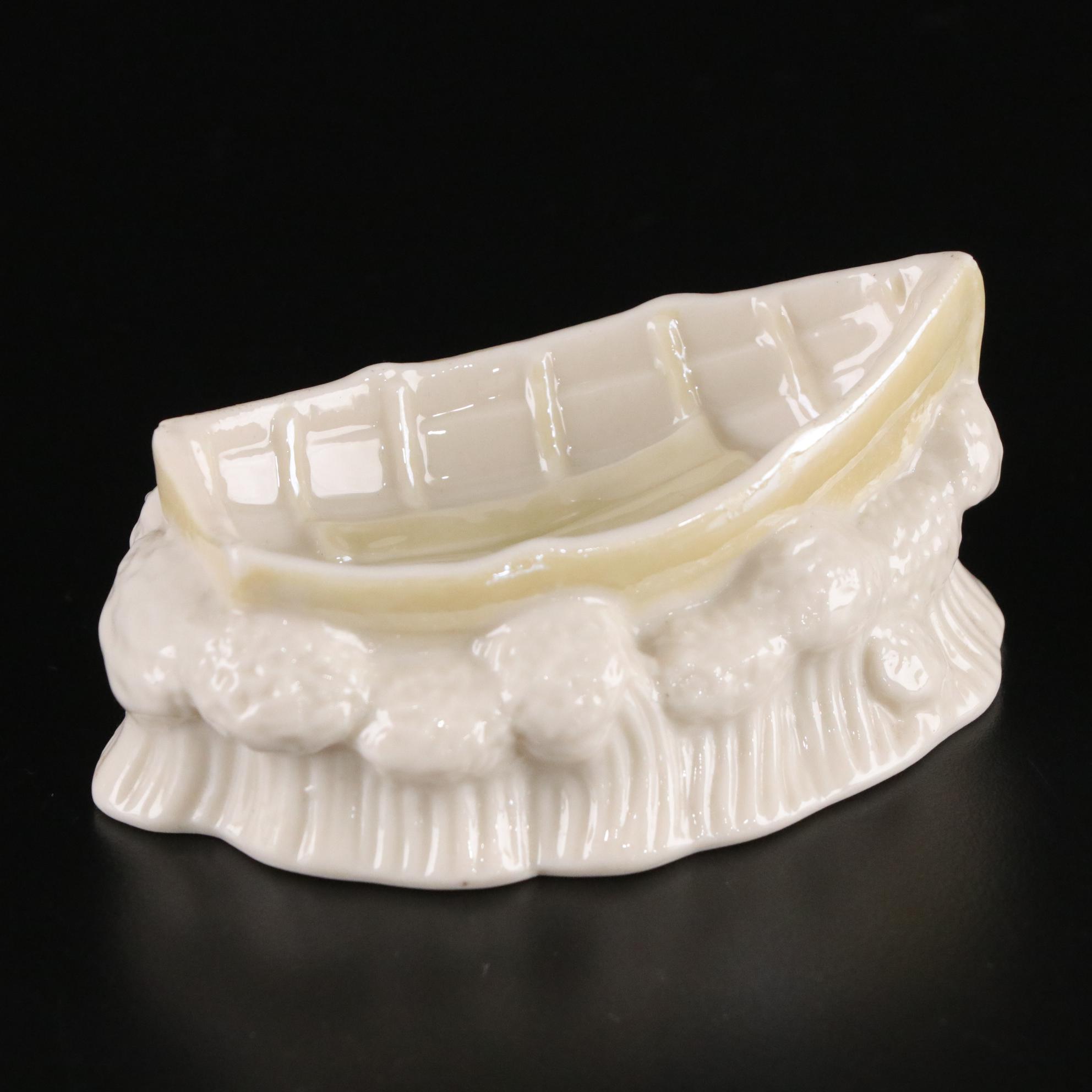 Belleek Porcelain "Dolphin" Spill Vase, Boat Shaped Ashtray, and Two Nut Cups