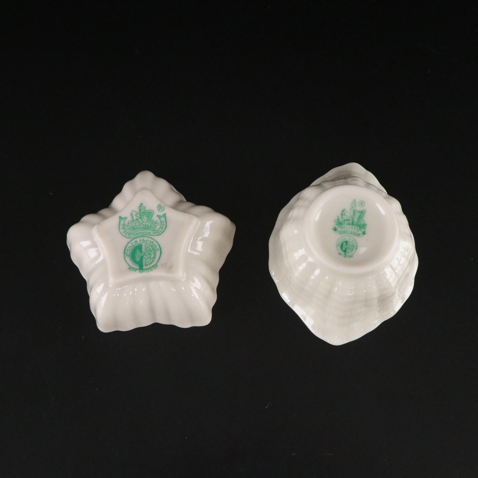 Belleek Porcelain "Dolphin" Spill Vase, Boat Shaped Ashtray, and Two Nut Cups