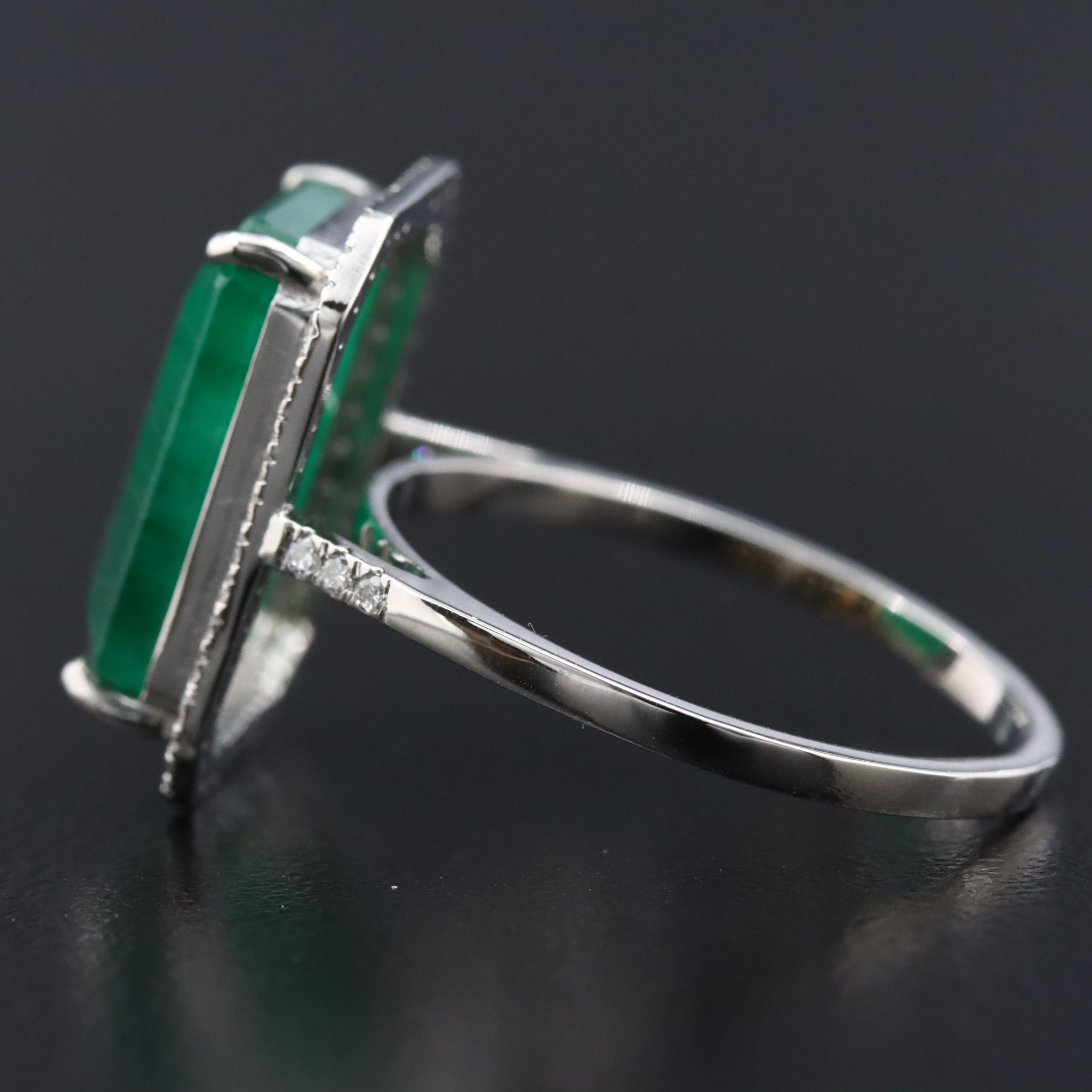 Platinum 5.55 CT Emerald and 0.19 CTW Diamond Ring