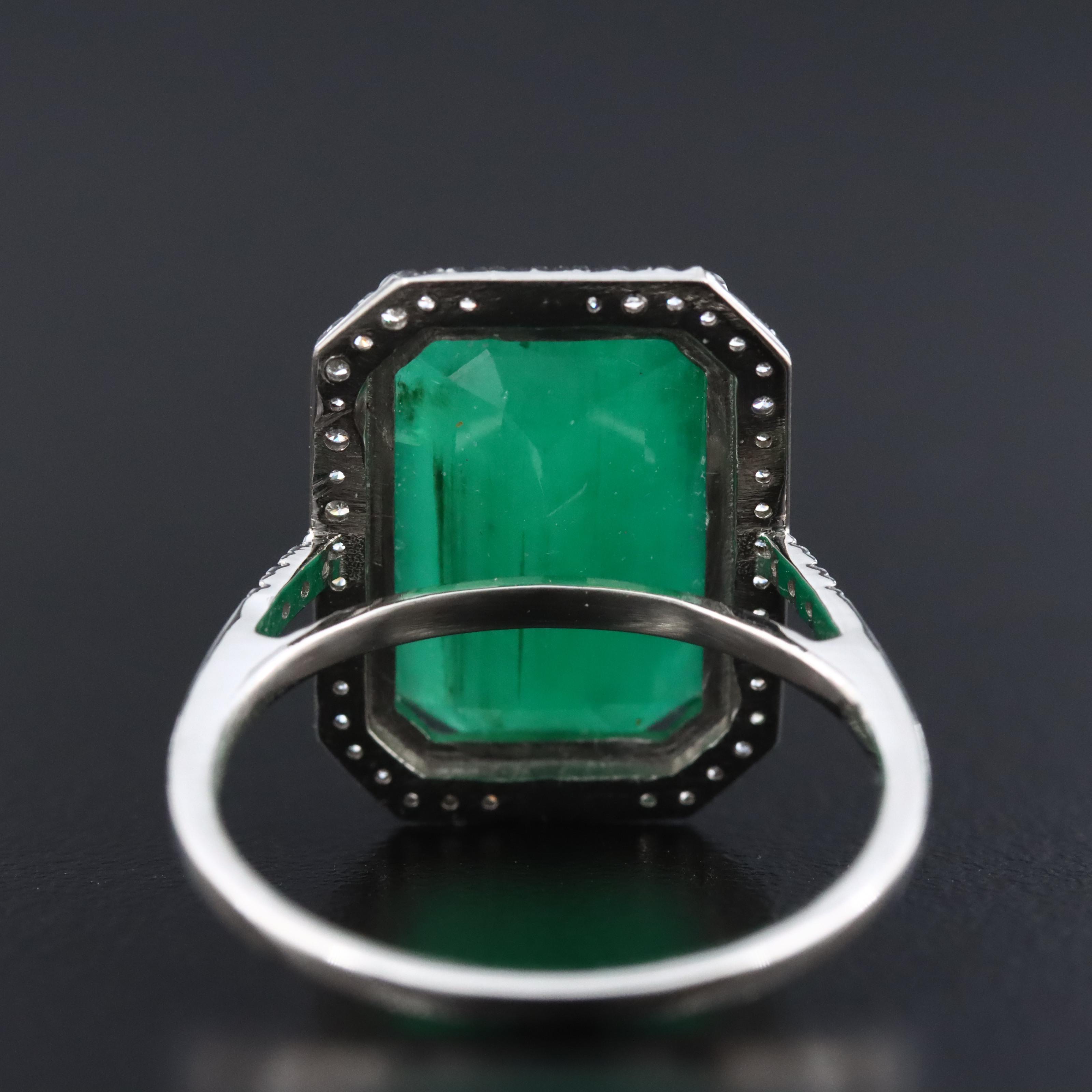 Platinum 6.38 CT Emerald and 0.20 CTW Diamond Ring