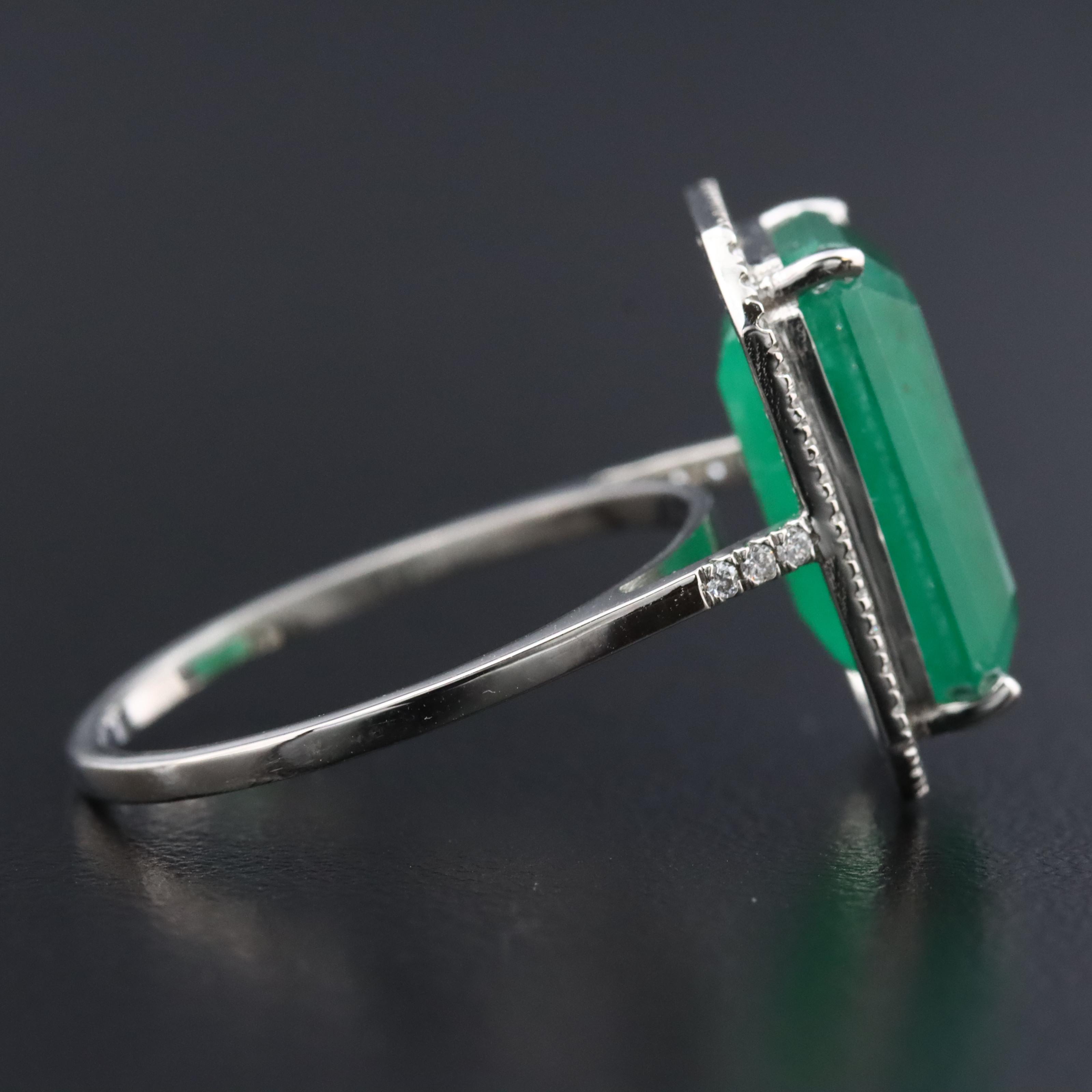 Platinum 6.38 CT Emerald and 0.20 CTW Diamond Ring