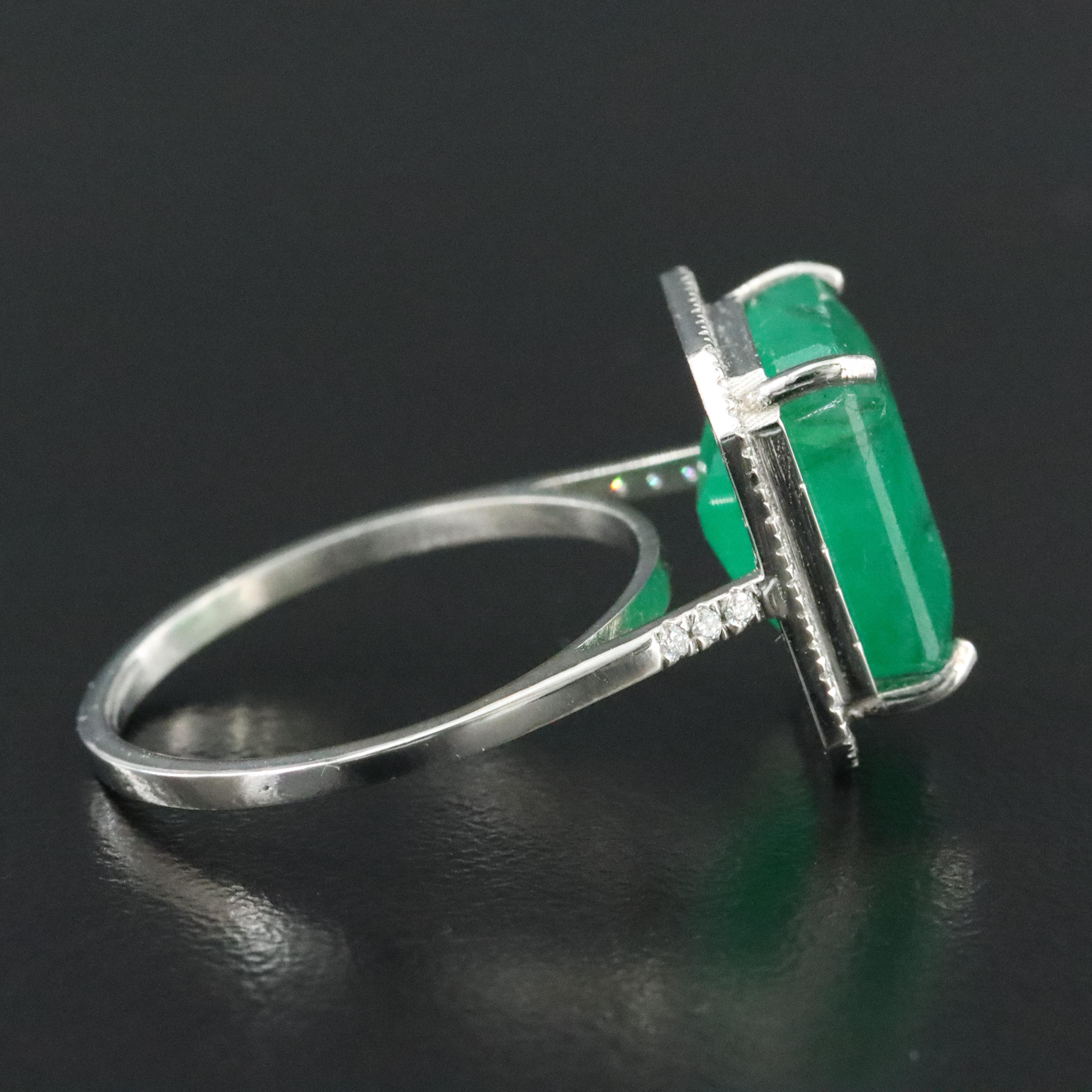 Platinum 8.88 CT Emerald and 0.20 CTW Diamond Ring