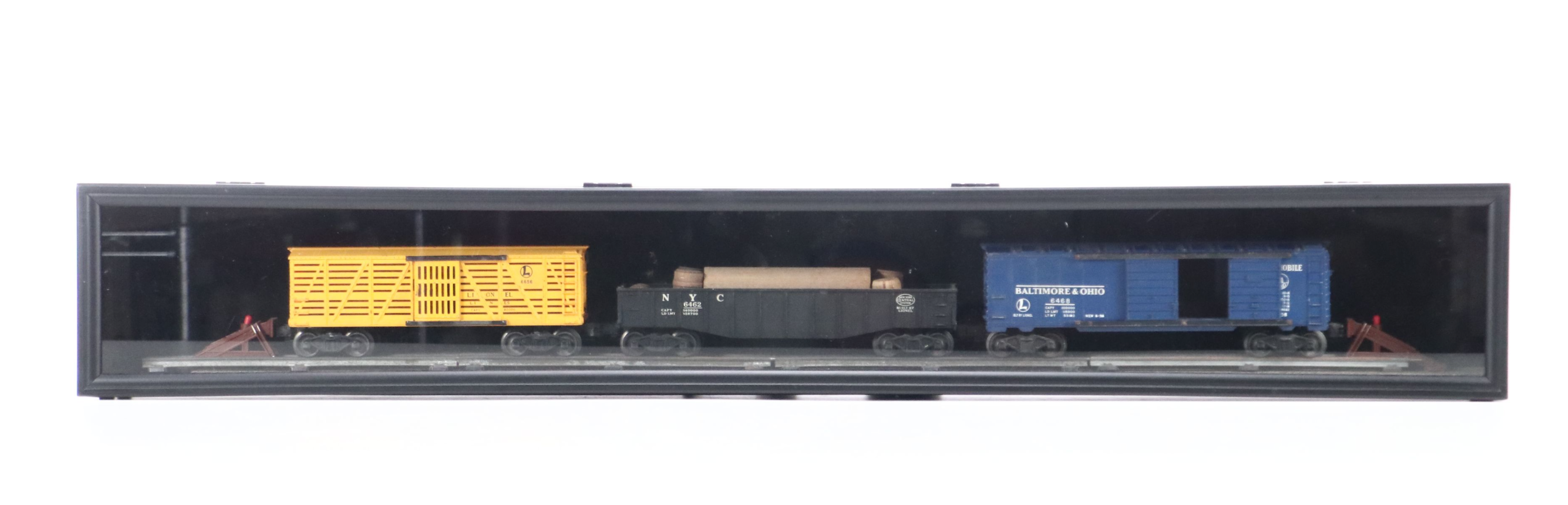 Lionel Steam Locomotive, Sunoco Tanker, Blue Box Car, and Other Freight Cars