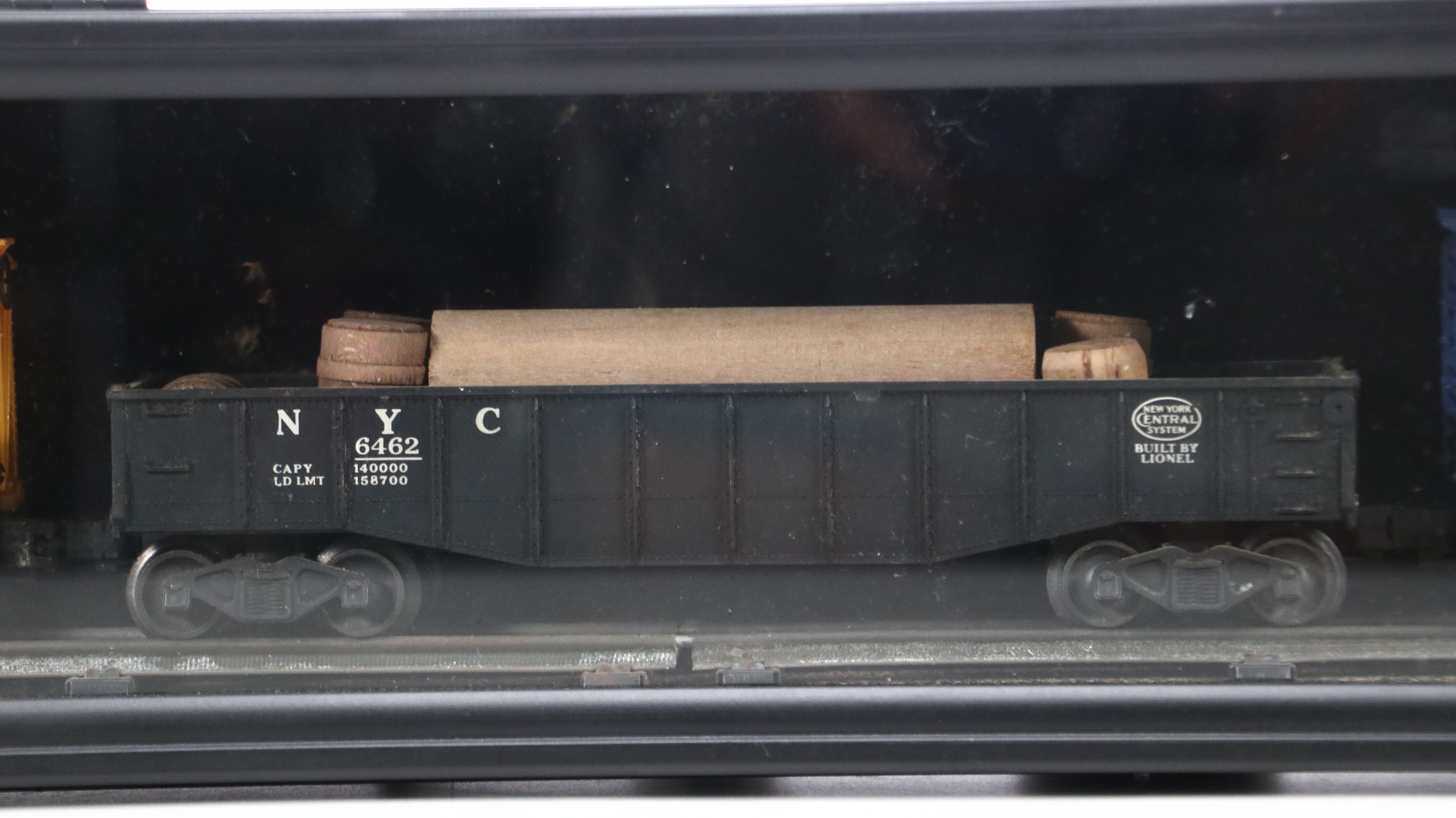 Lionel Steam Locomotive, Sunoco Tanker, Blue Box Car, and Other Freight Cars