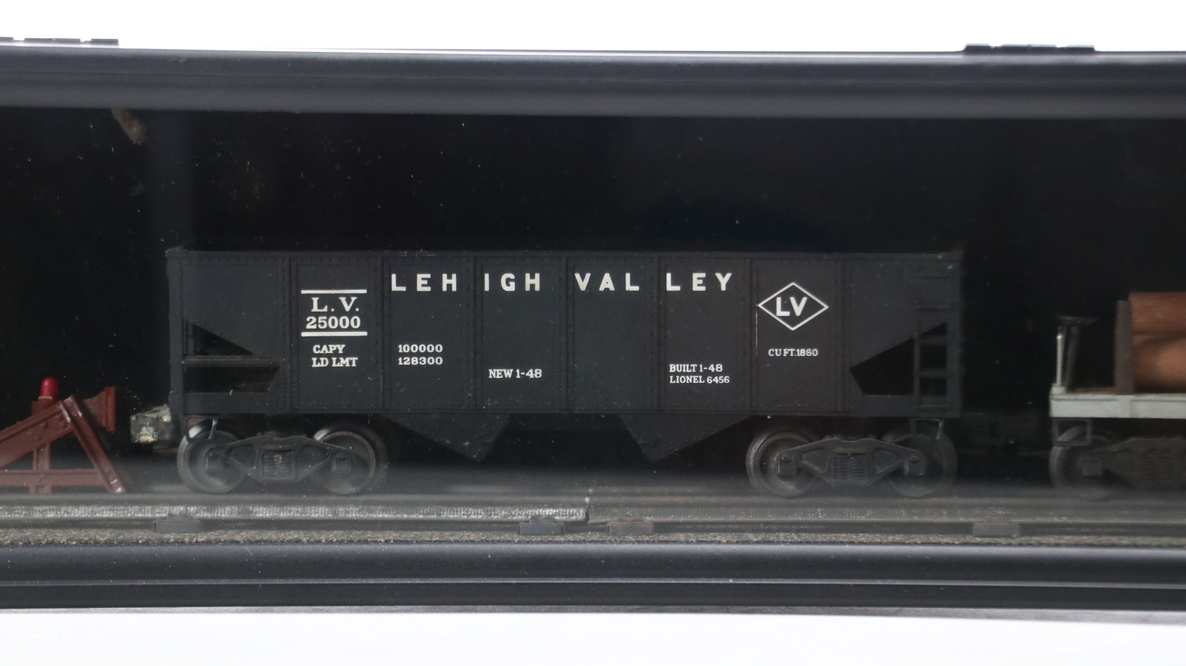 Lionel Steam Locomotive, Sunoco Tanker, Blue Box Car, and Other Freight Cars