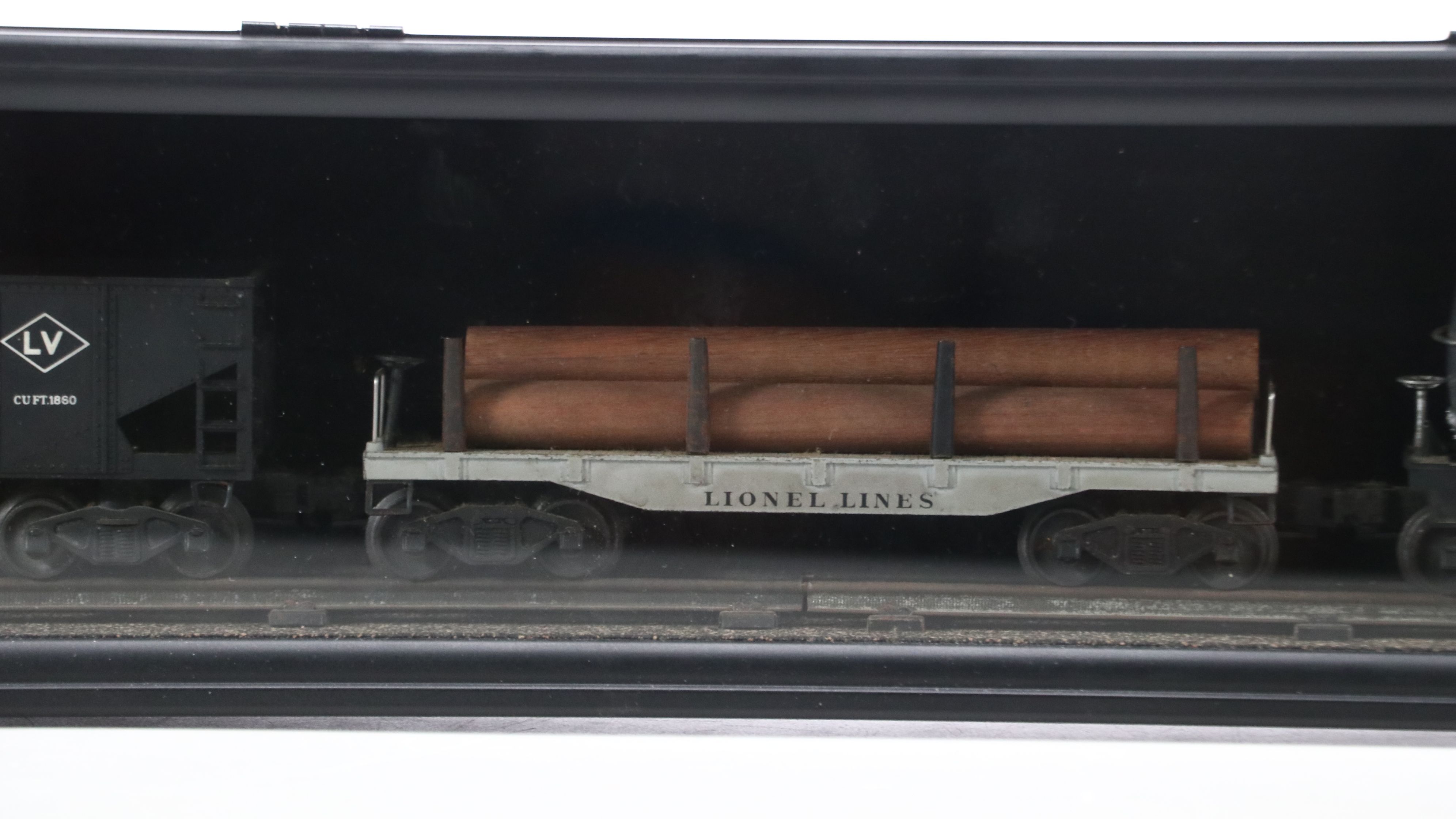 Lionel Steam Locomotive, Sunoco Tanker, Blue Box Car, and Other Freight Cars