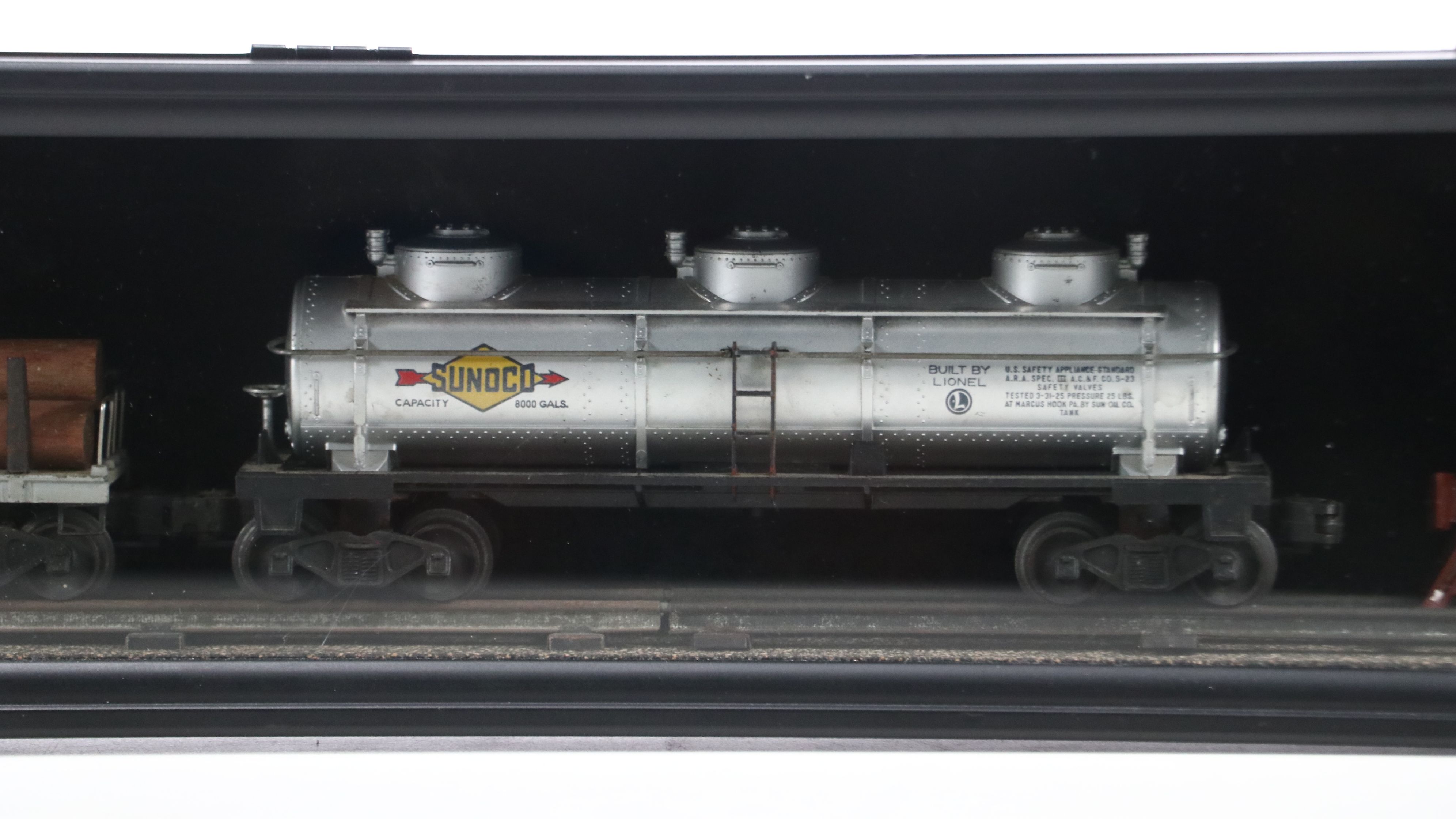 Lionel Steam Locomotive, Sunoco Tanker, Blue Box Car, and Other Freight Cars