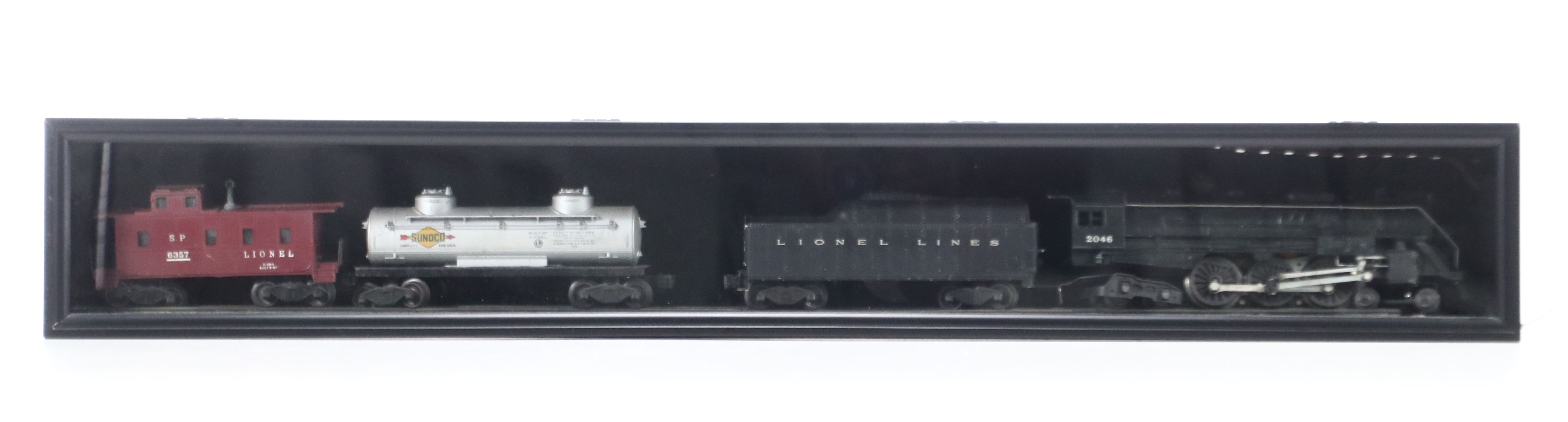 Lionel Steam Locomotive, Sunoco Tanker, Blue Box Car, and Other Freight Cars