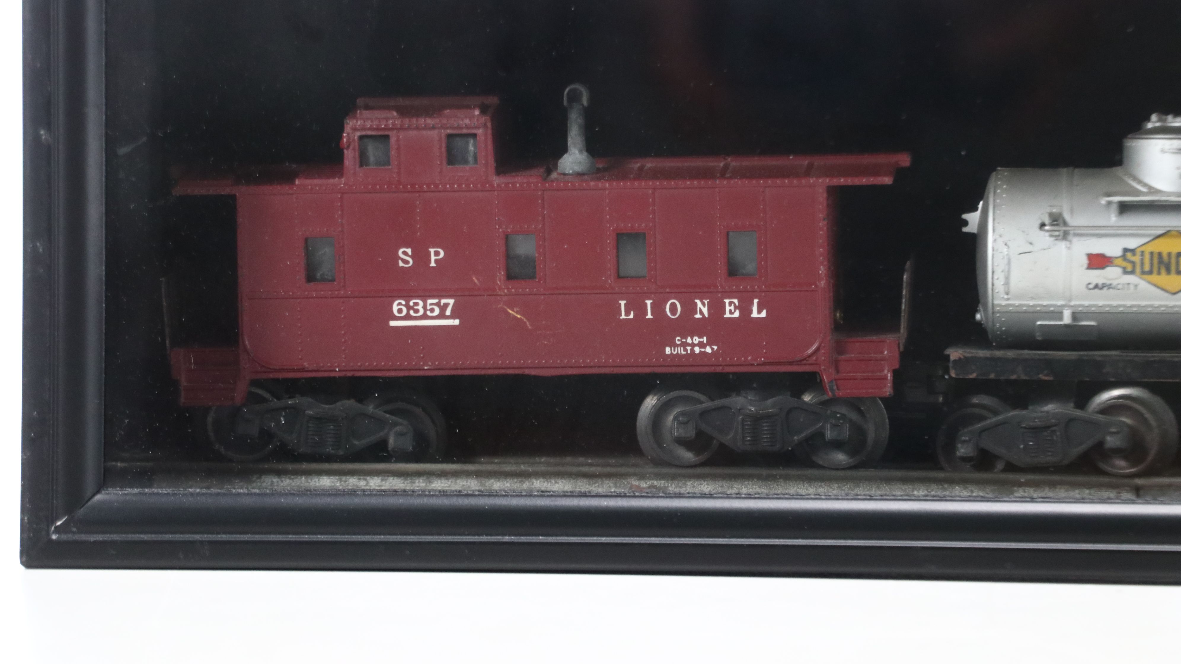 Lionel Steam Locomotive, Sunoco Tanker, Blue Box Car, and Other Freight Cars