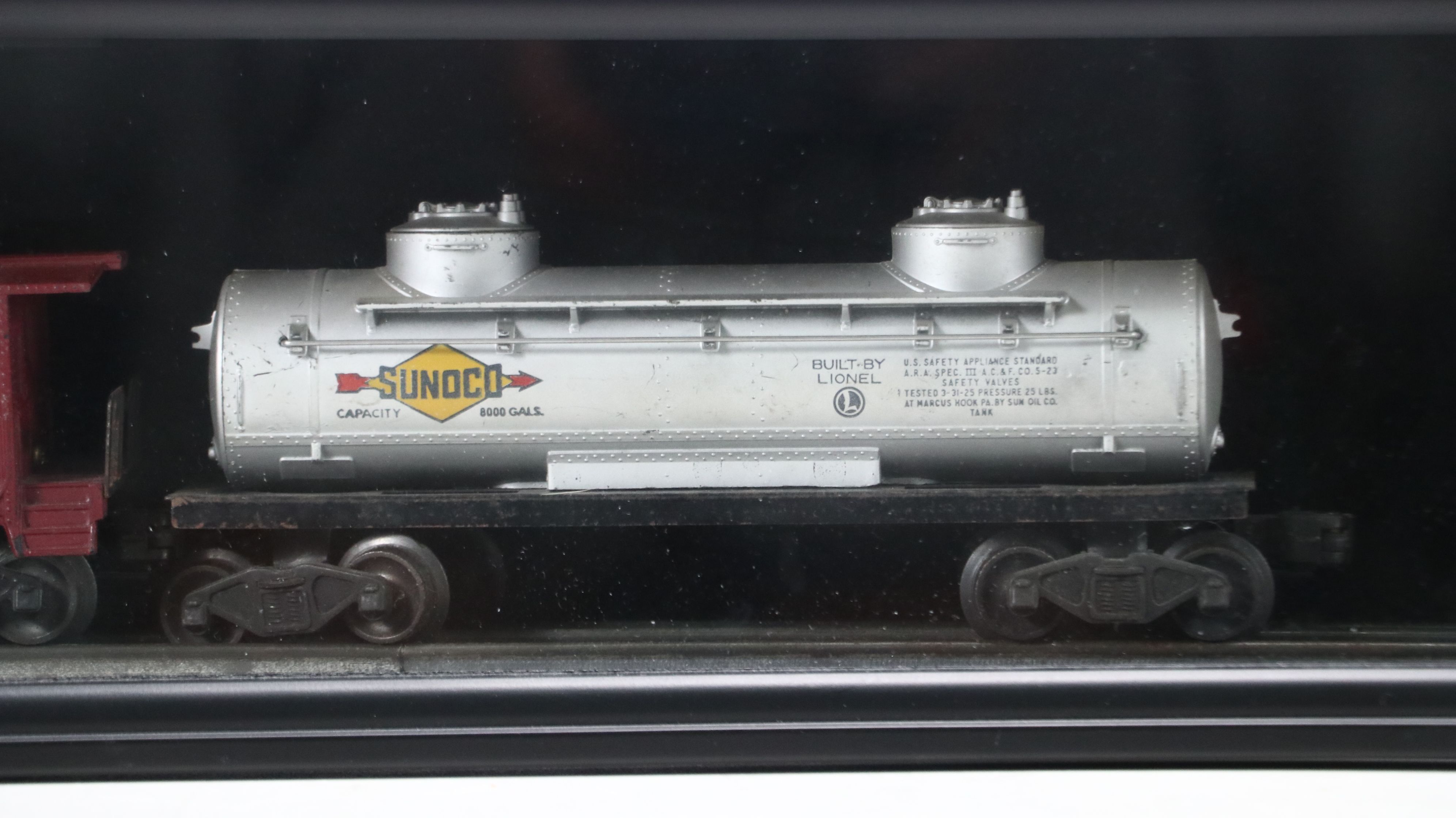Lionel Steam Locomotive, Sunoco Tanker, Blue Box Car, and Other Freight Cars