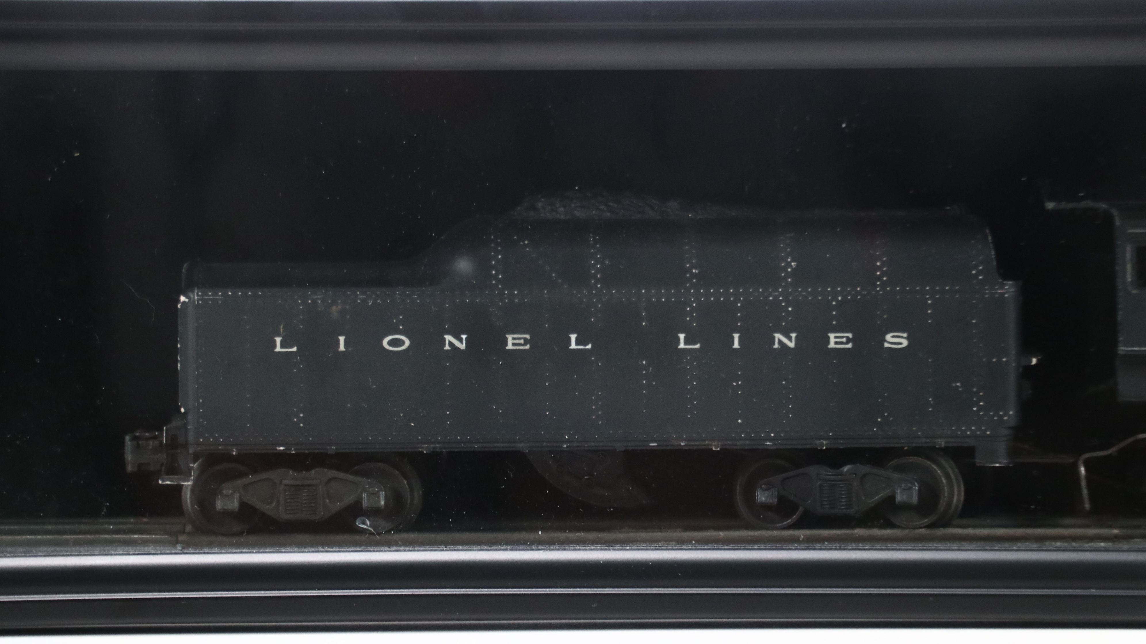 Lionel Steam Locomotive, Sunoco Tanker, Blue Box Car, and Other Freight Cars