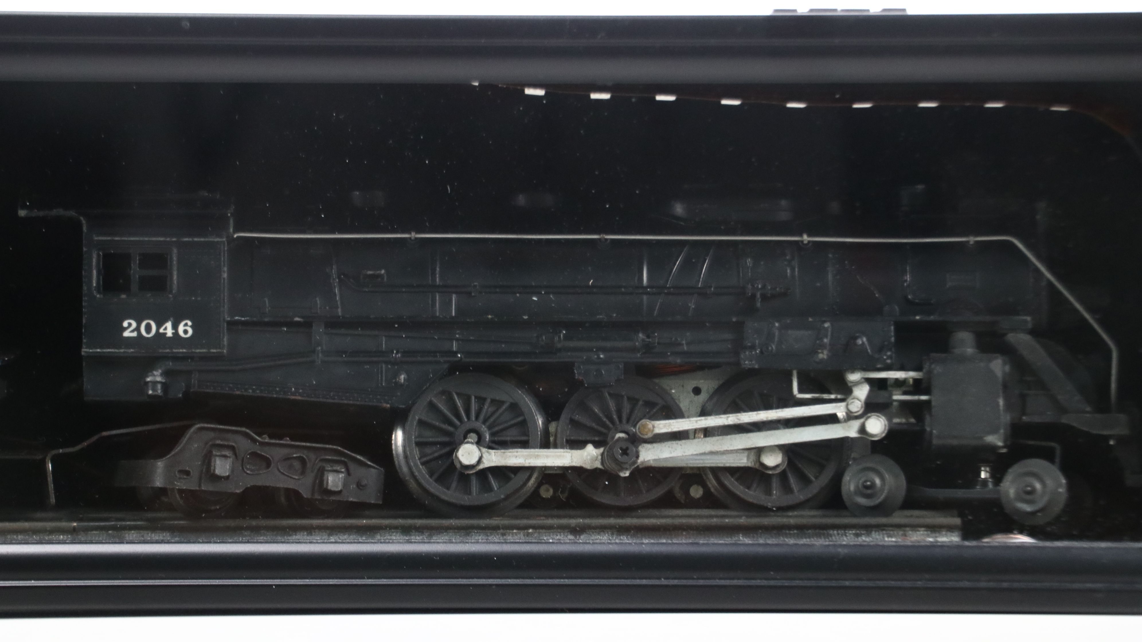 Lionel Steam Locomotive, Sunoco Tanker, Blue Box Car, and Other Freight Cars