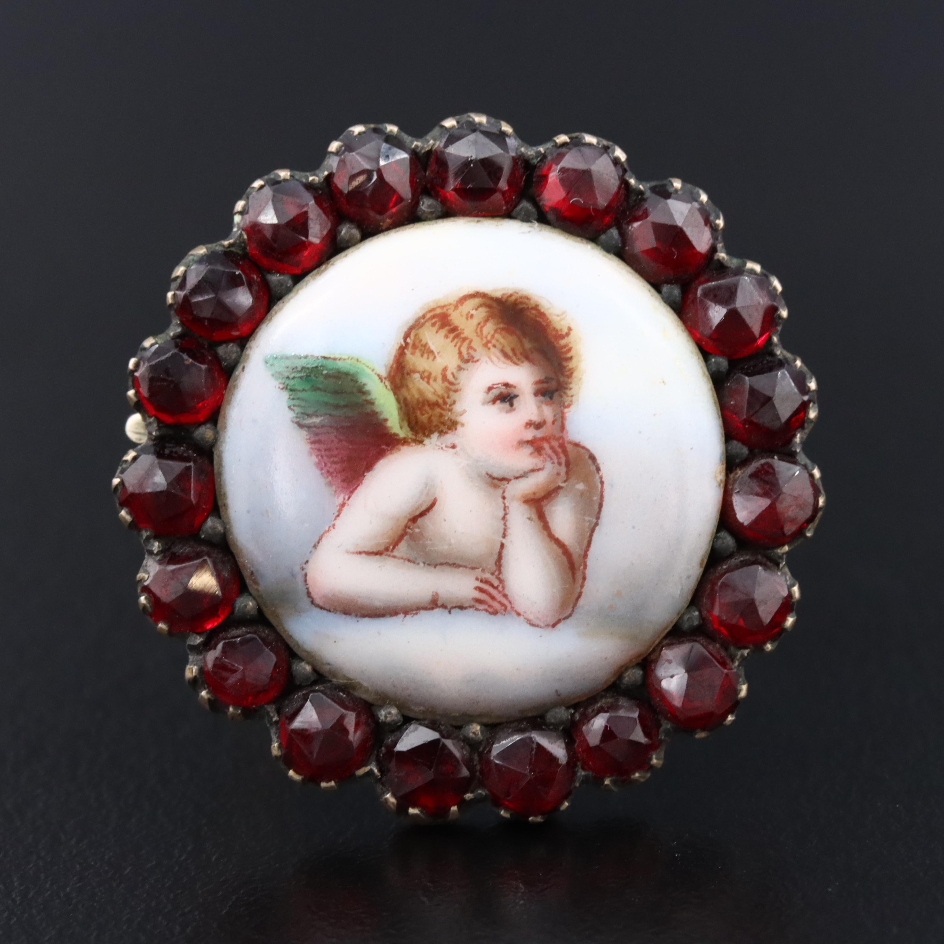 Antique Garnet and Ceramic Cherub Brooch