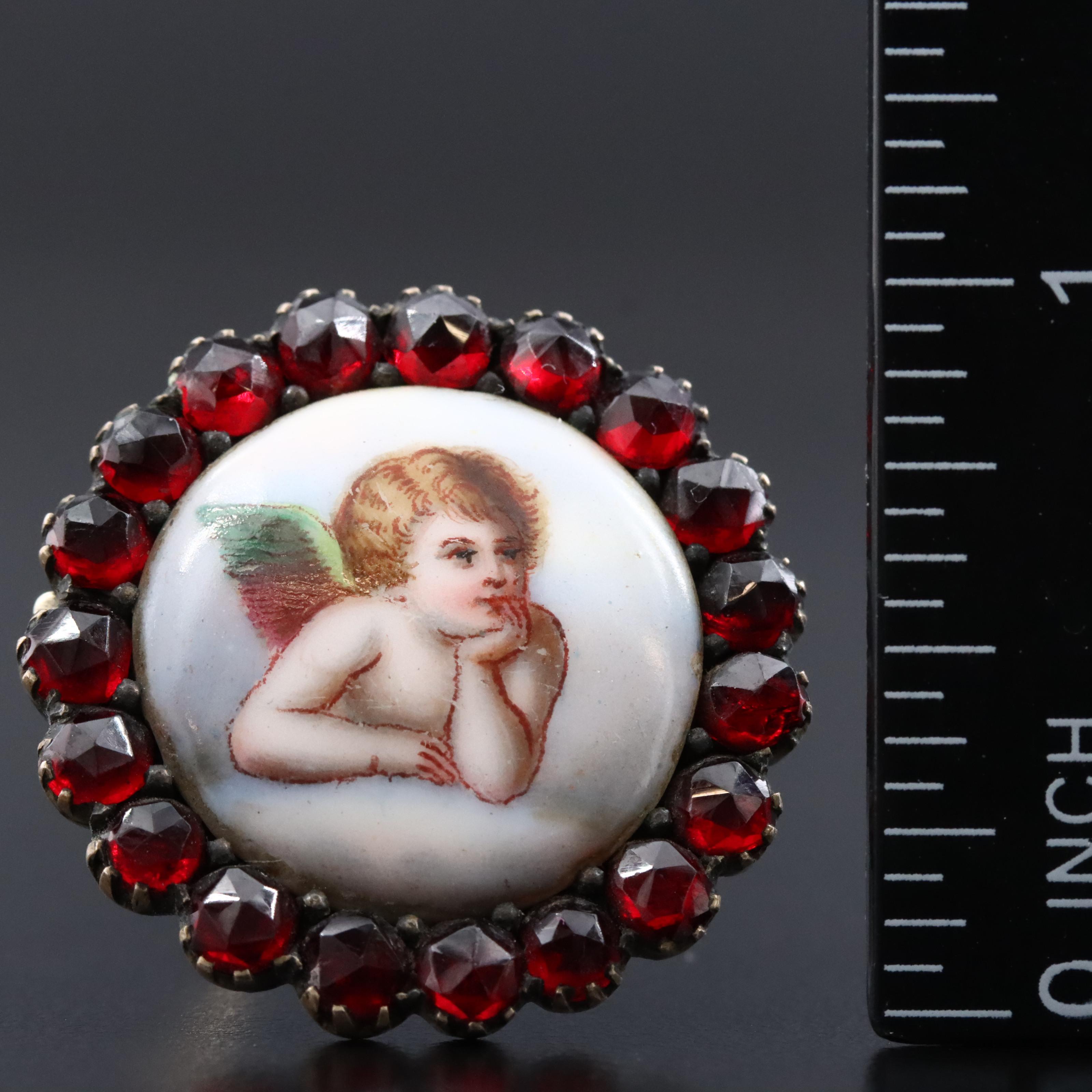 Antique Garnet and Ceramic Cherub Brooch