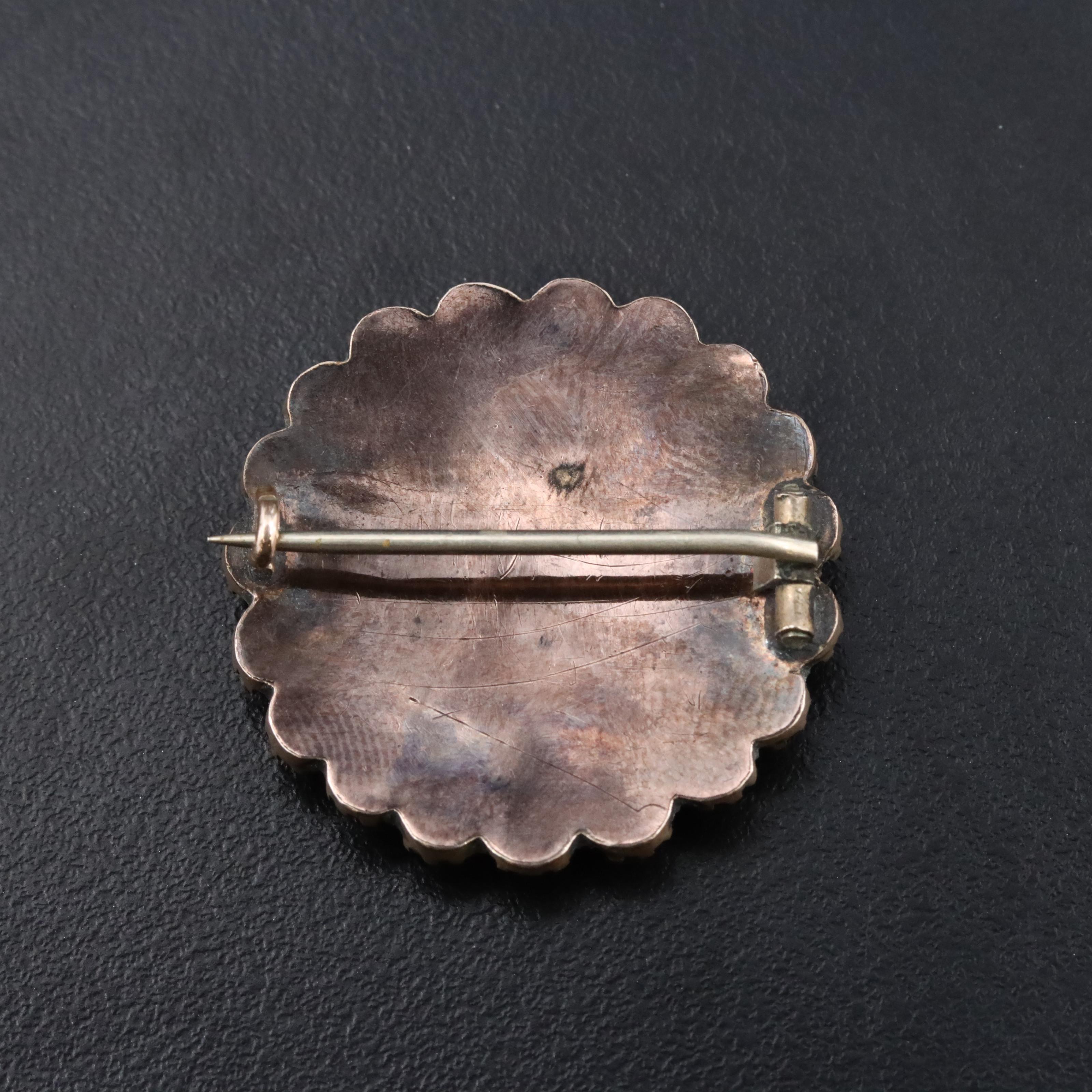 Antique Garnet and Ceramic Cherub Brooch