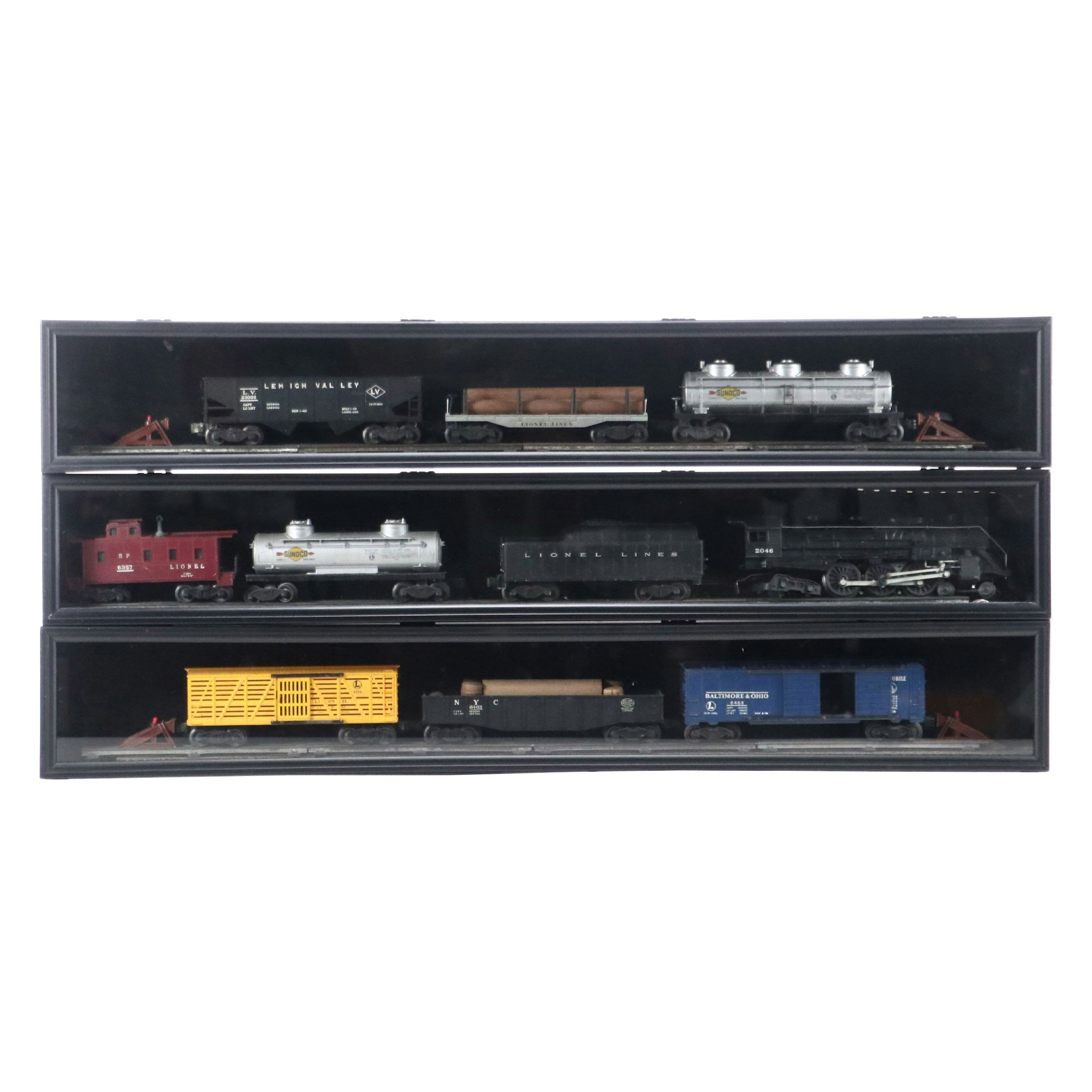 Lionel Steam Locomotive, Sunoco Tanker, Blue Box Car, and Other Freight Cars