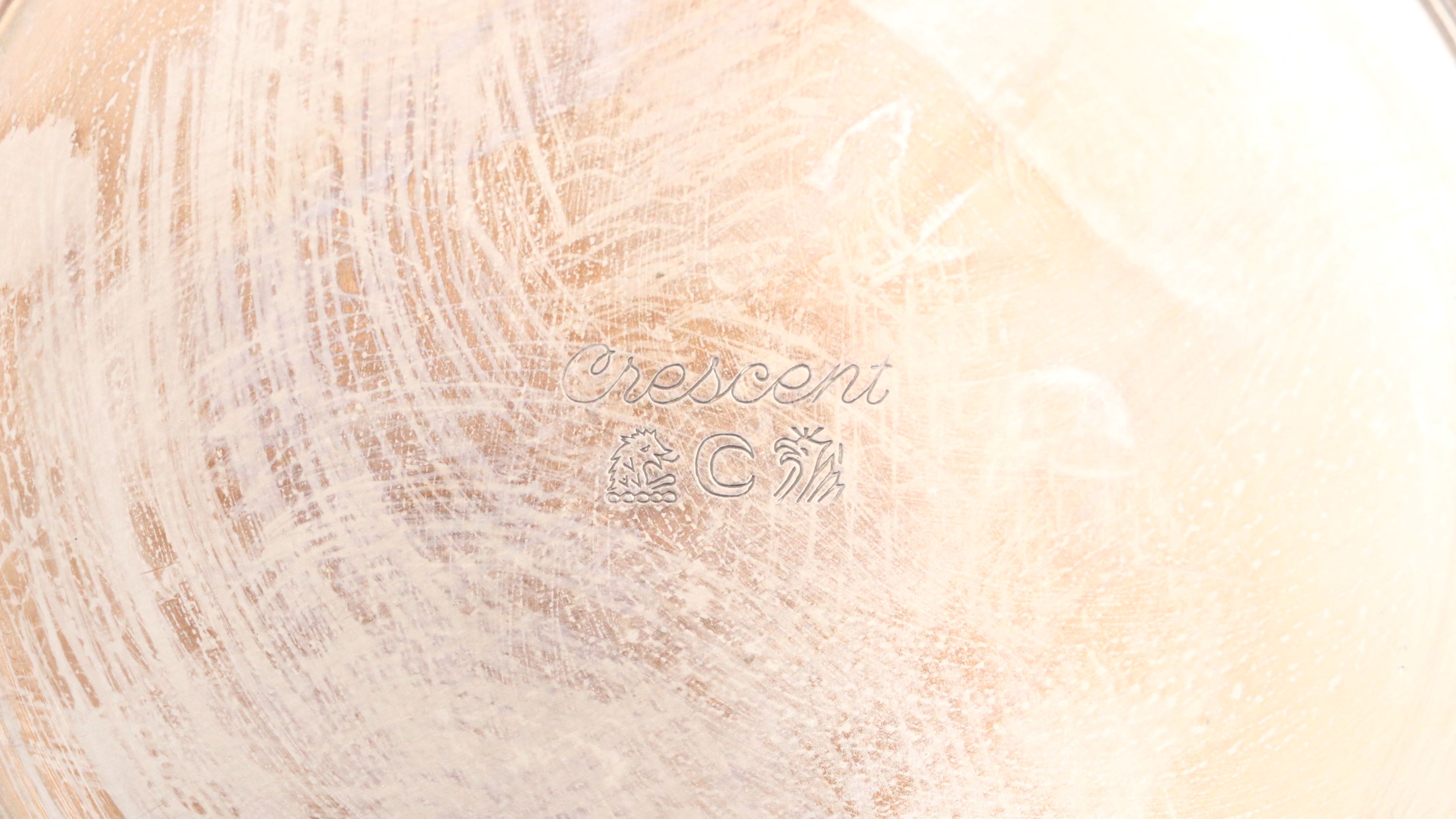 Crescent with Other Silver Plate Water Pitchers and Serving Pieces